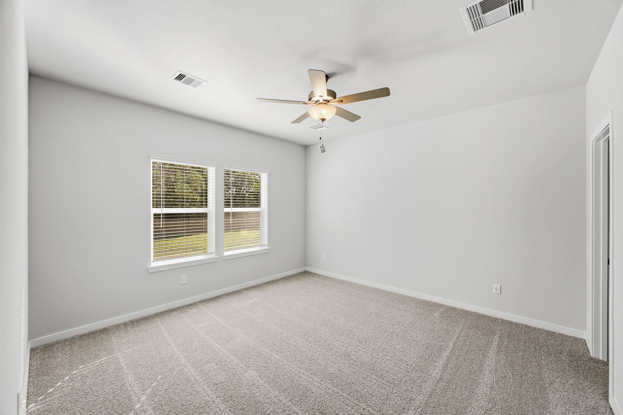 A ceiling fan in a room.