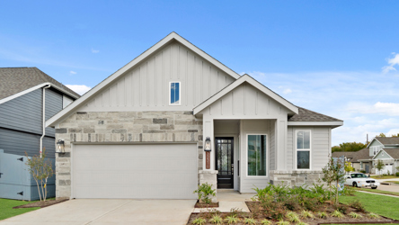 A white house with a garage.