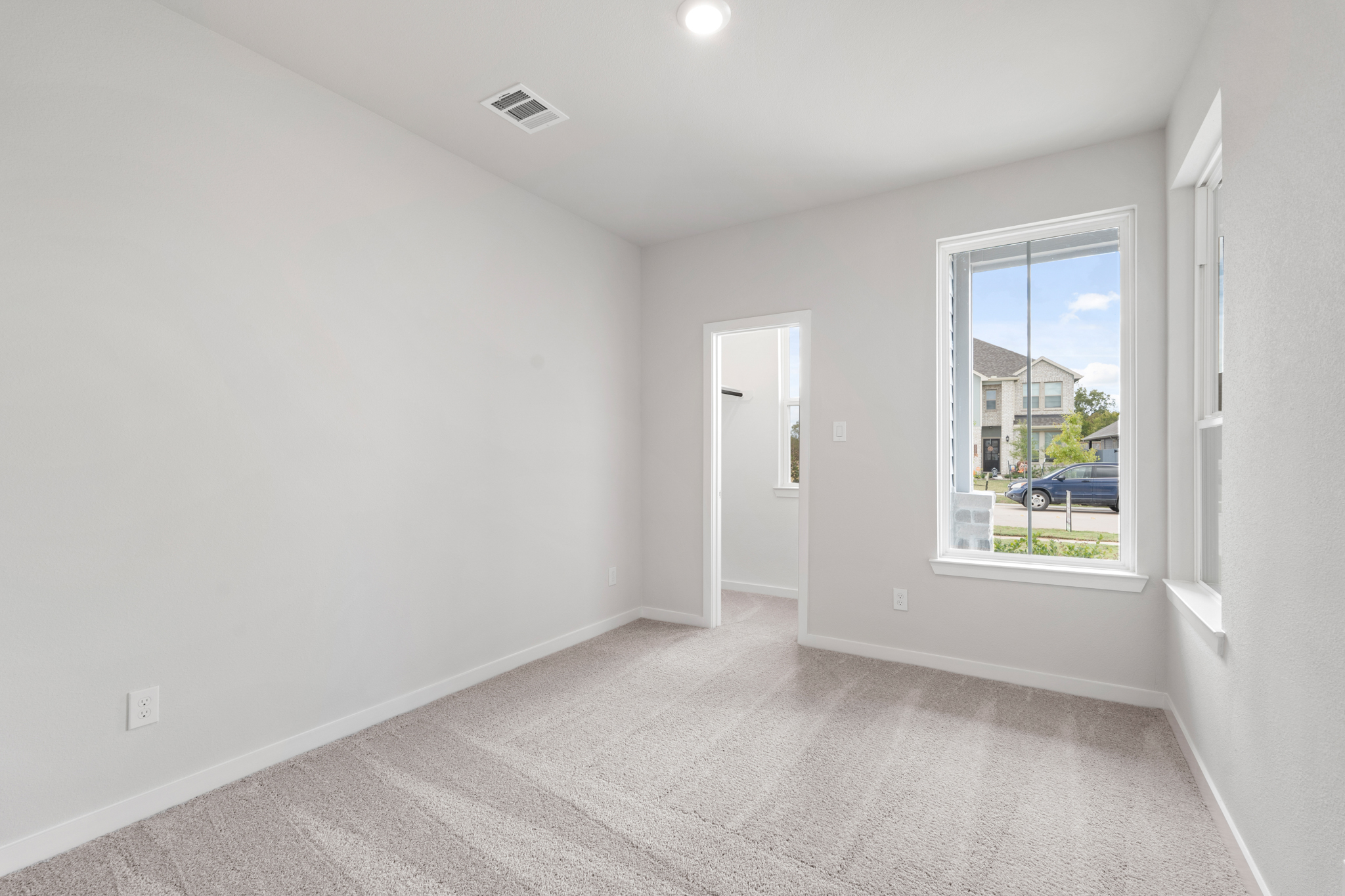 A hallway with a window.