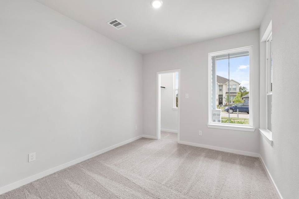 A hallway with a window.