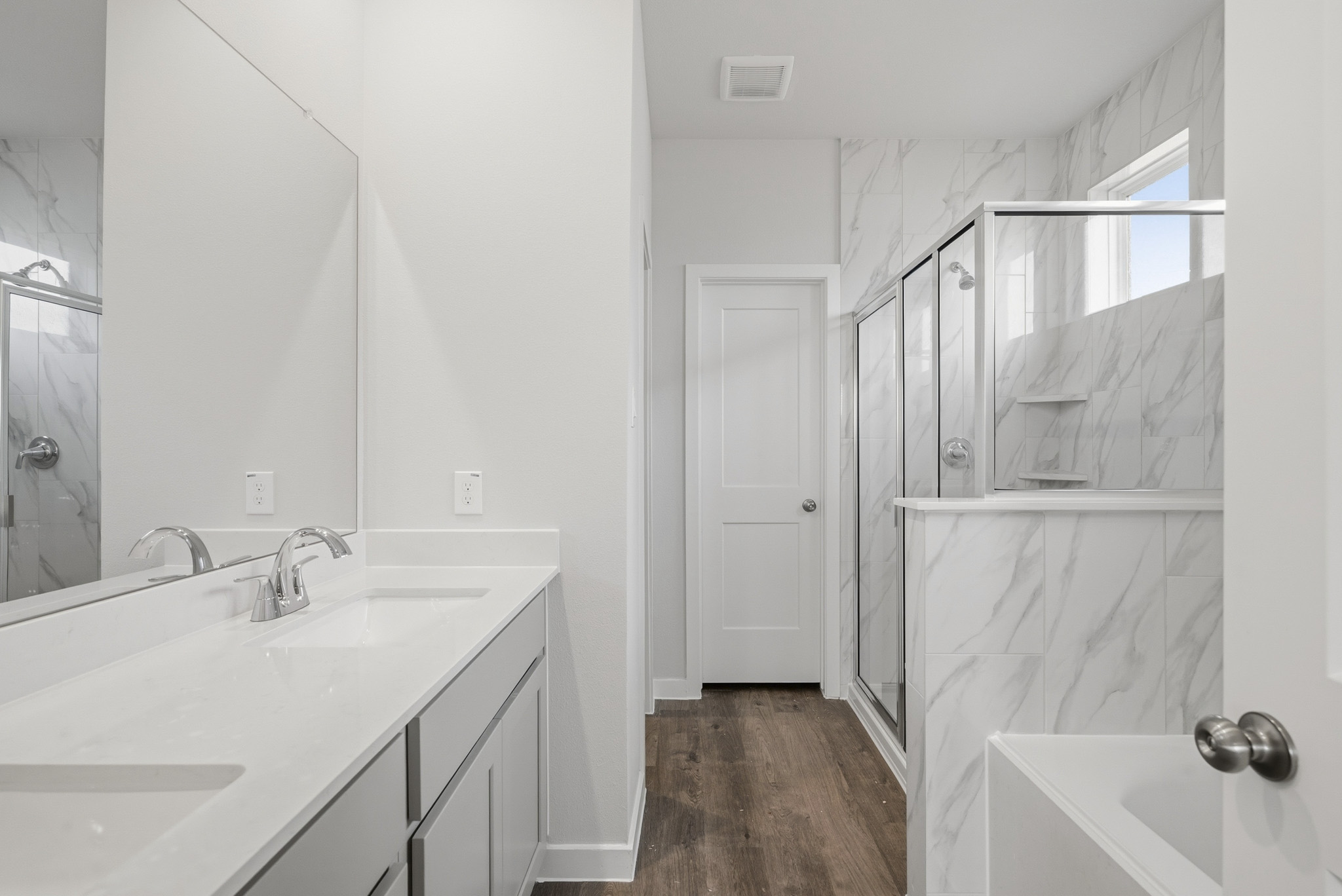 A bathroom with a glass shower.