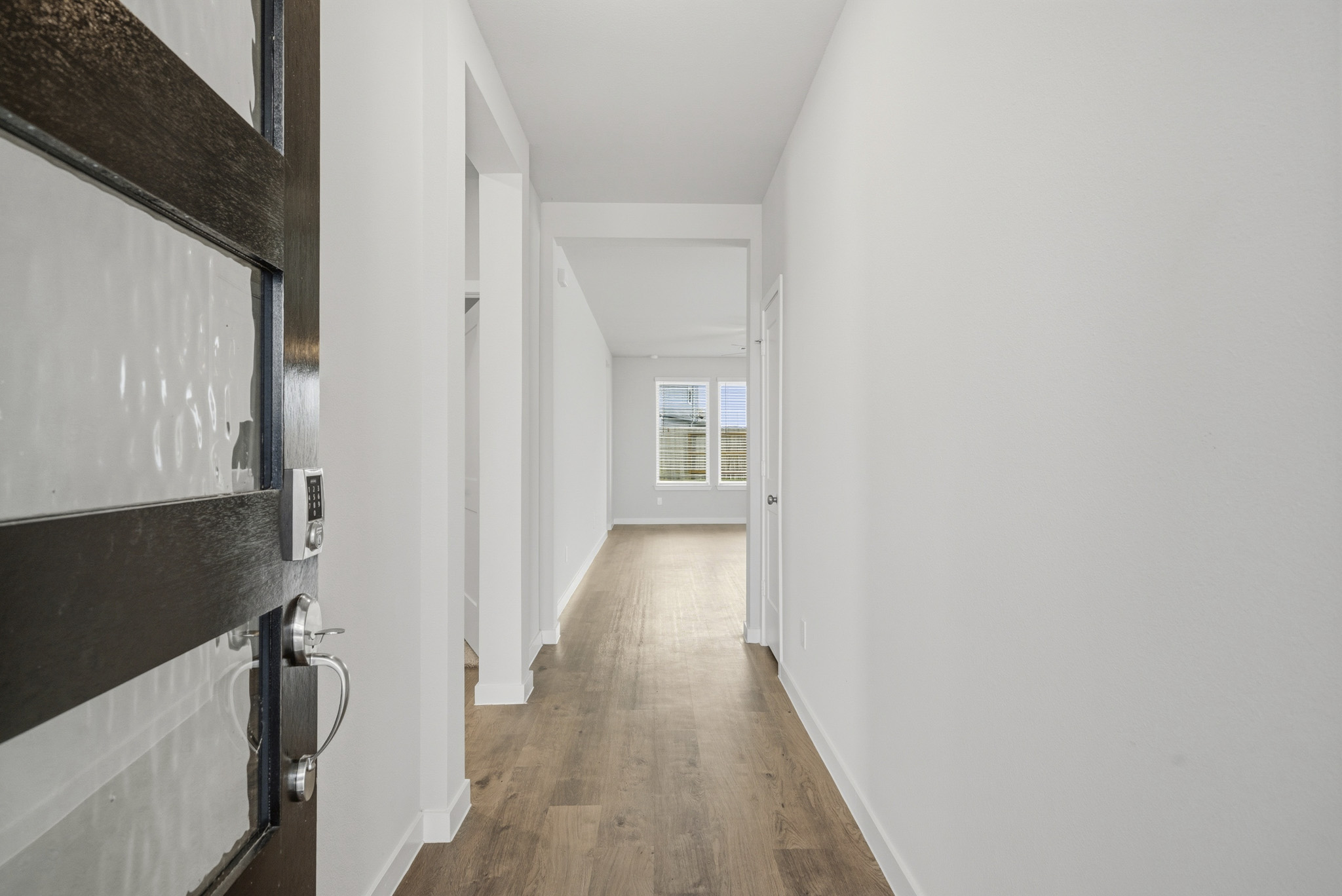 A hallway with white walls.