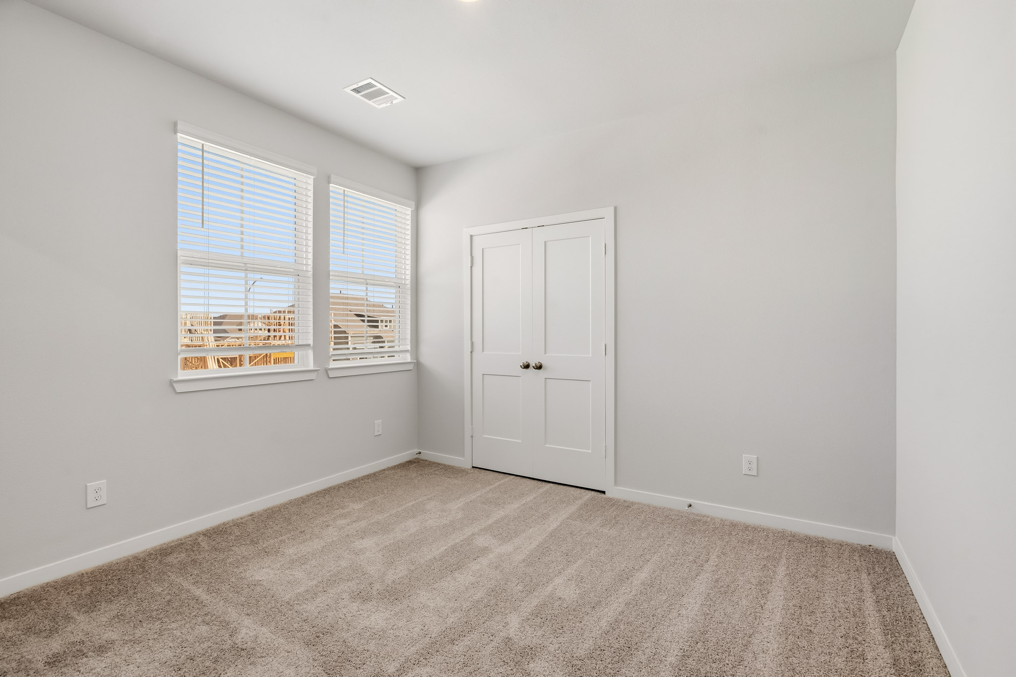A room with a door and a window.