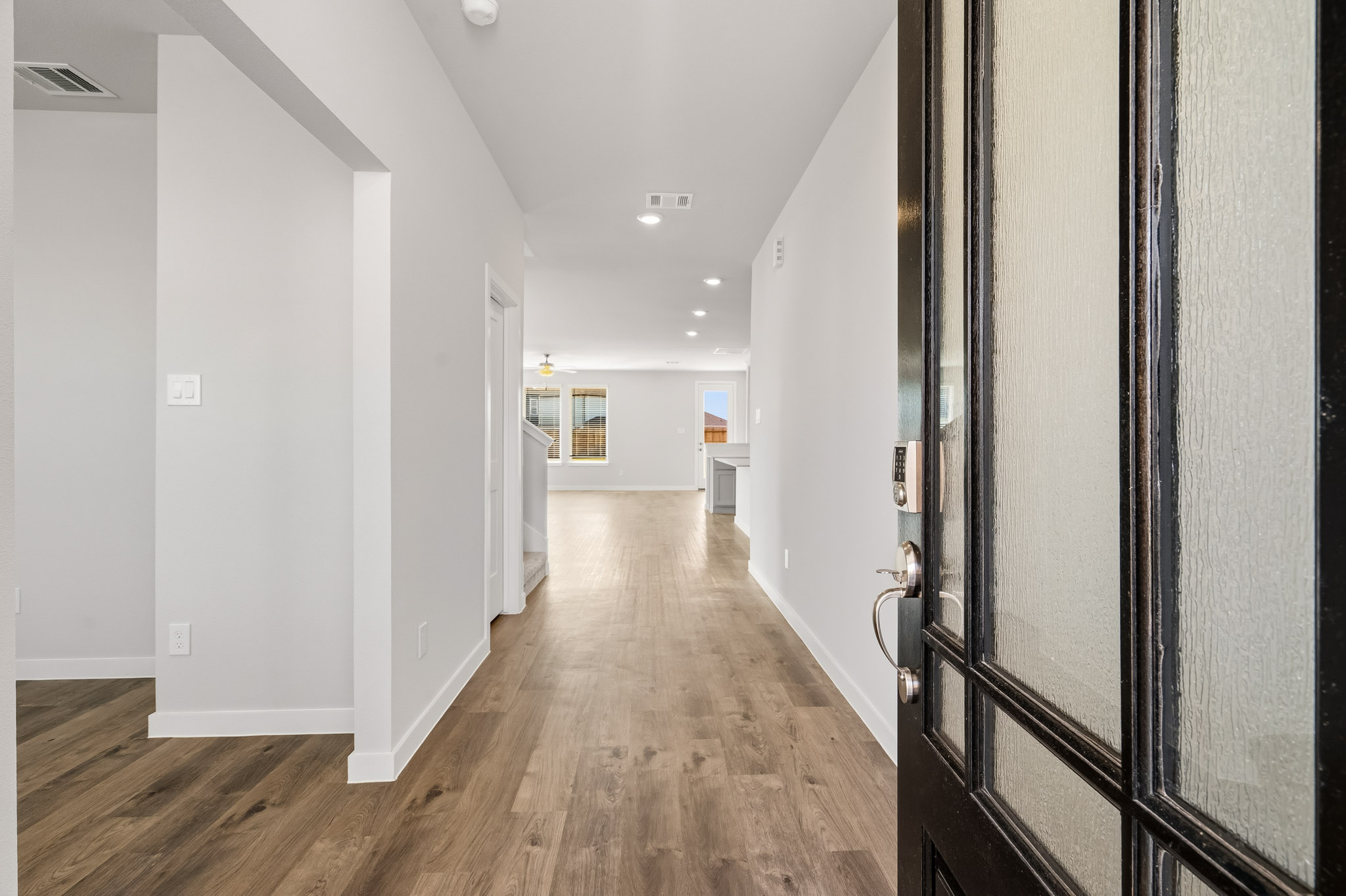 A hallway with white walls.