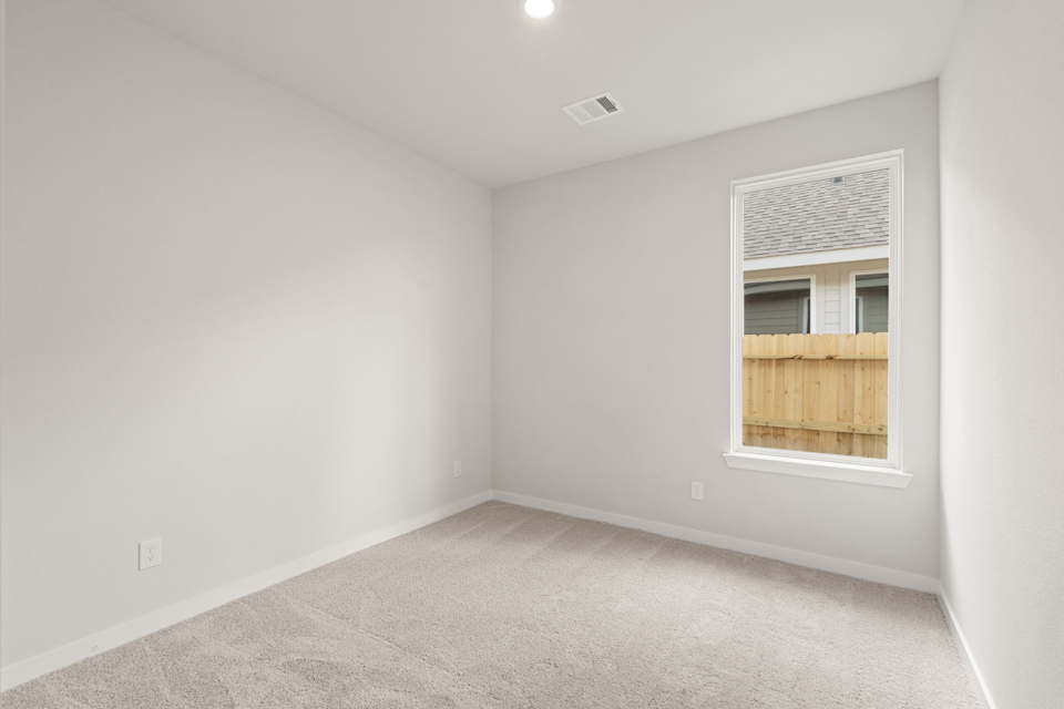 A room with a window and a door.