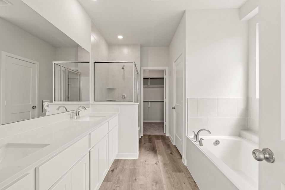 A bathroom with white tiles.