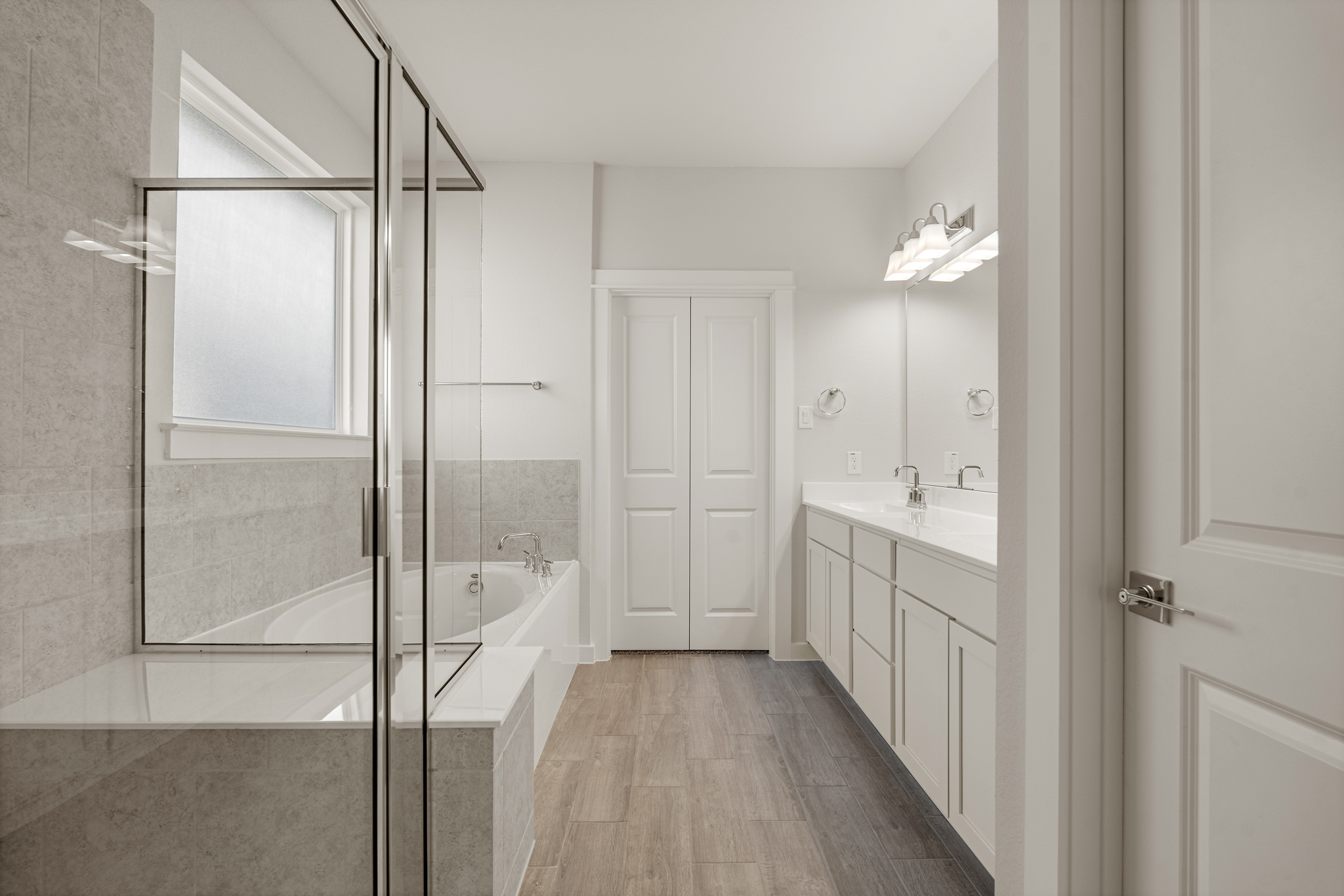 A bathroom with a tub and sink.