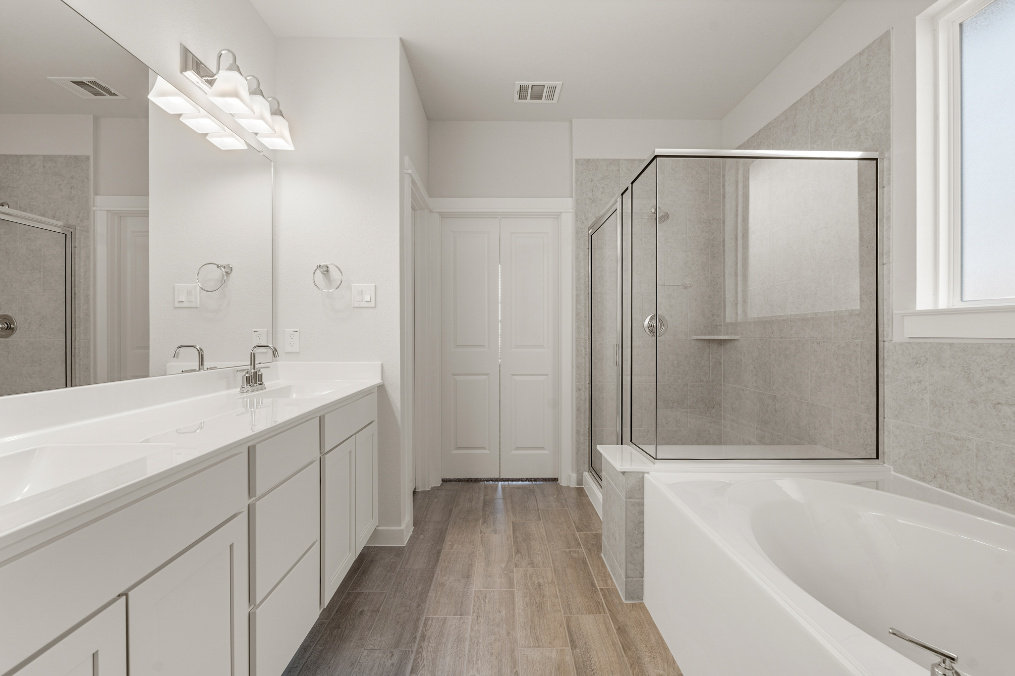 A bathroom with a tub and sink.