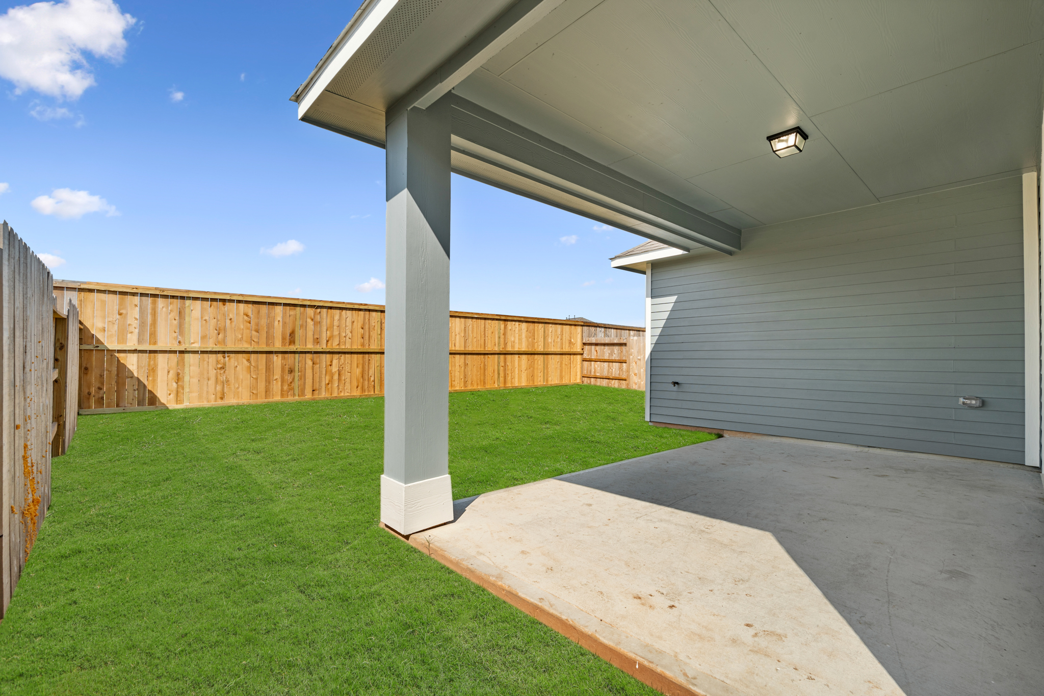 A building with a grass yard.