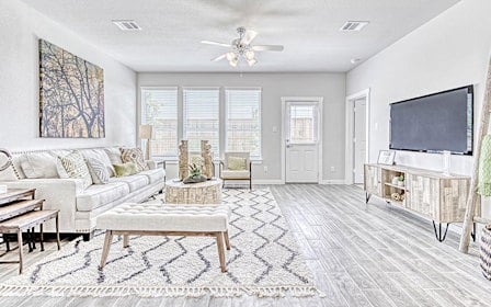 A living room with a tv and couches.