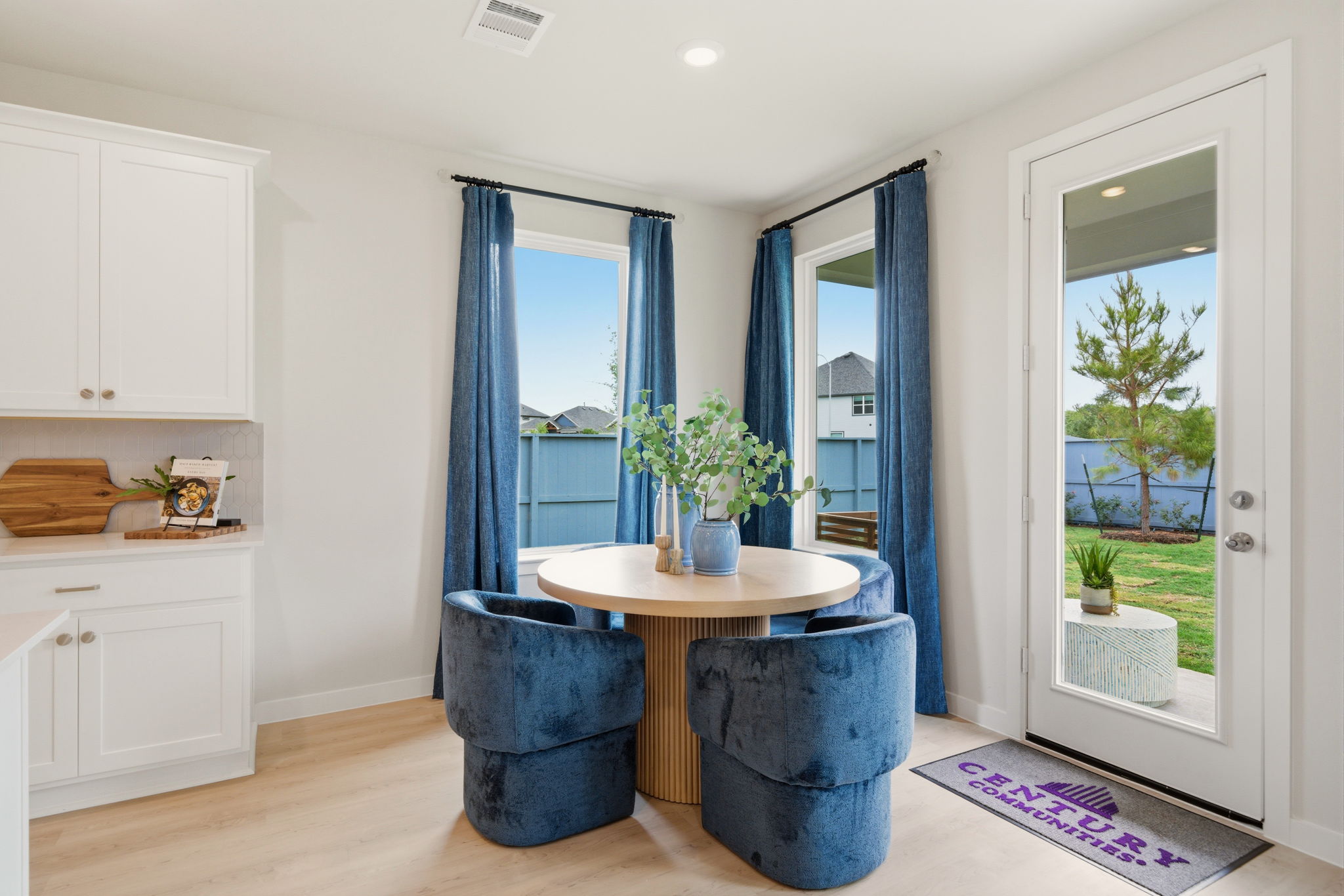 A room with a table and chairs.