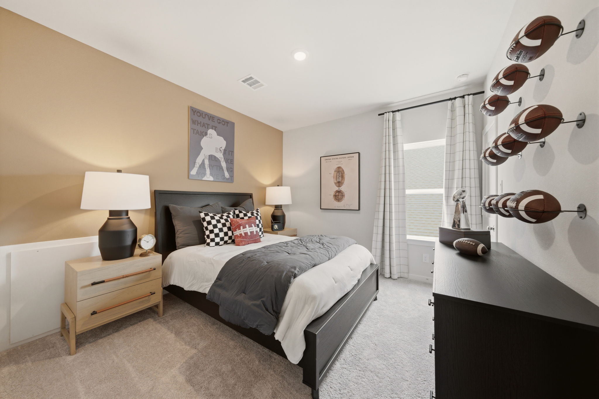 A bedroom with a bed and lamps.