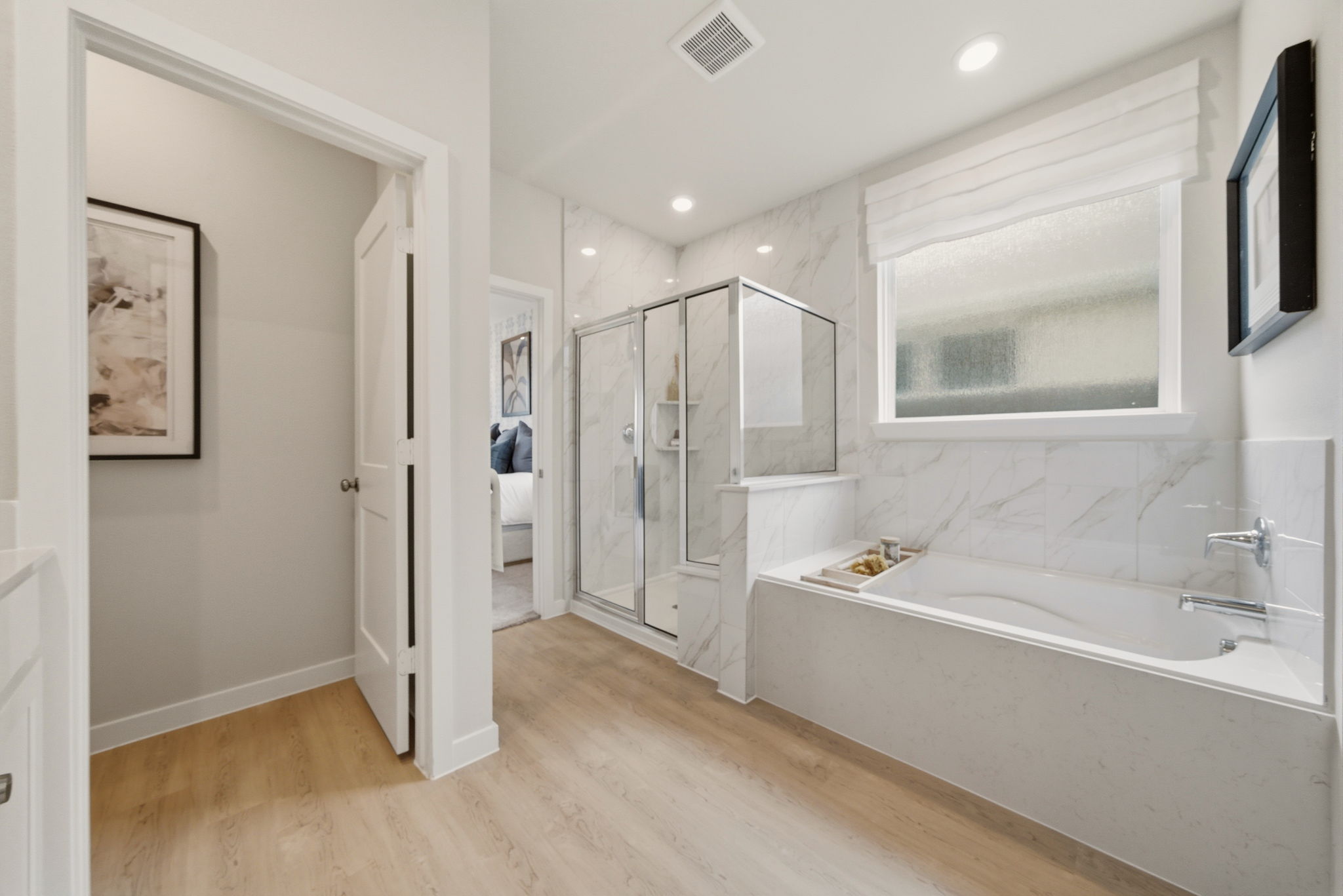 A bathroom with a tub and a sink.