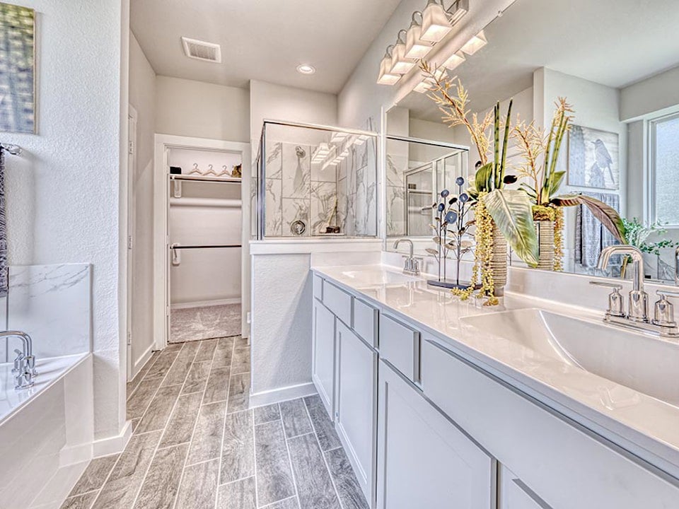 A bathroom with a large mirror.