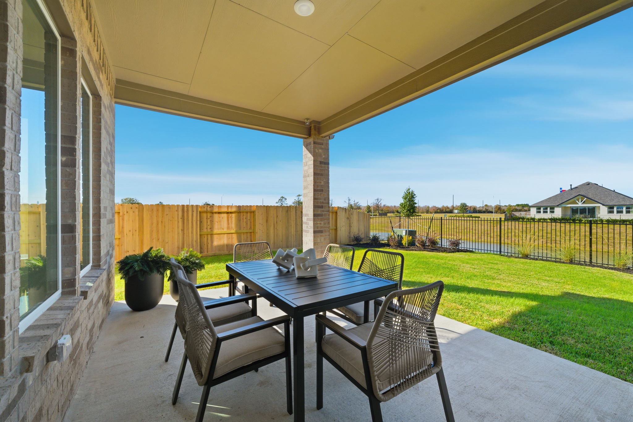 A table and chairs on a patio.