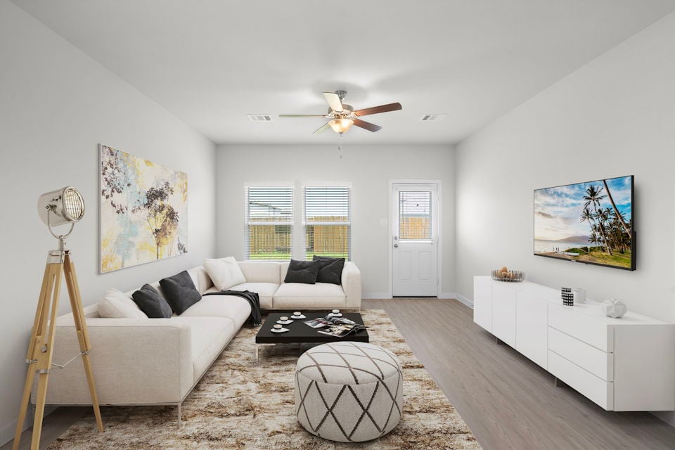 A living room with a couch and a table.