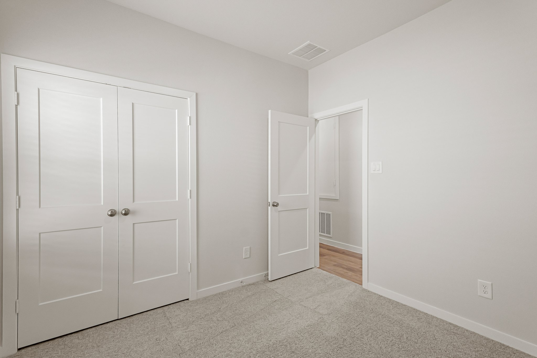 A room with white doors.
