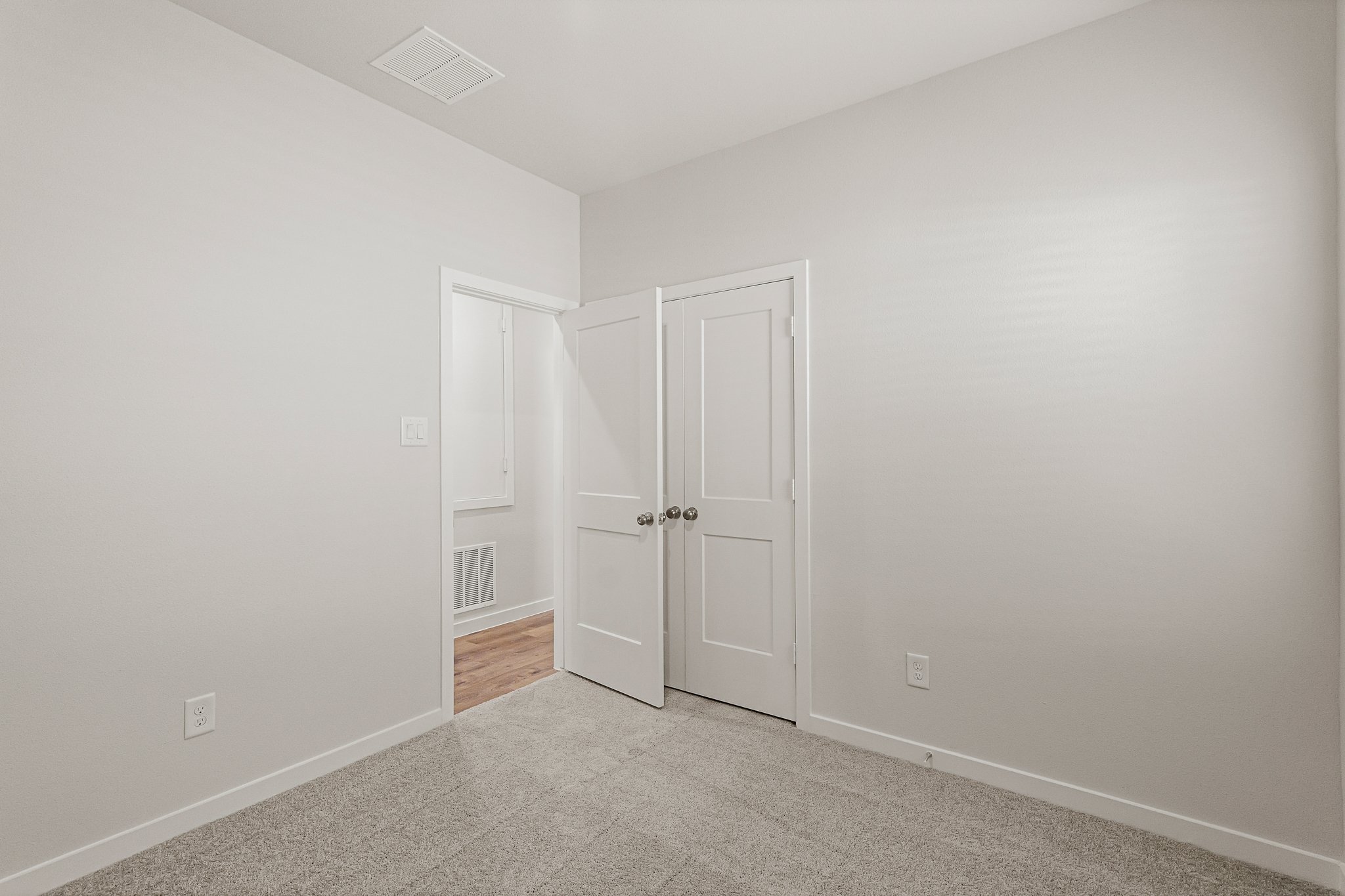 A room with white doors.