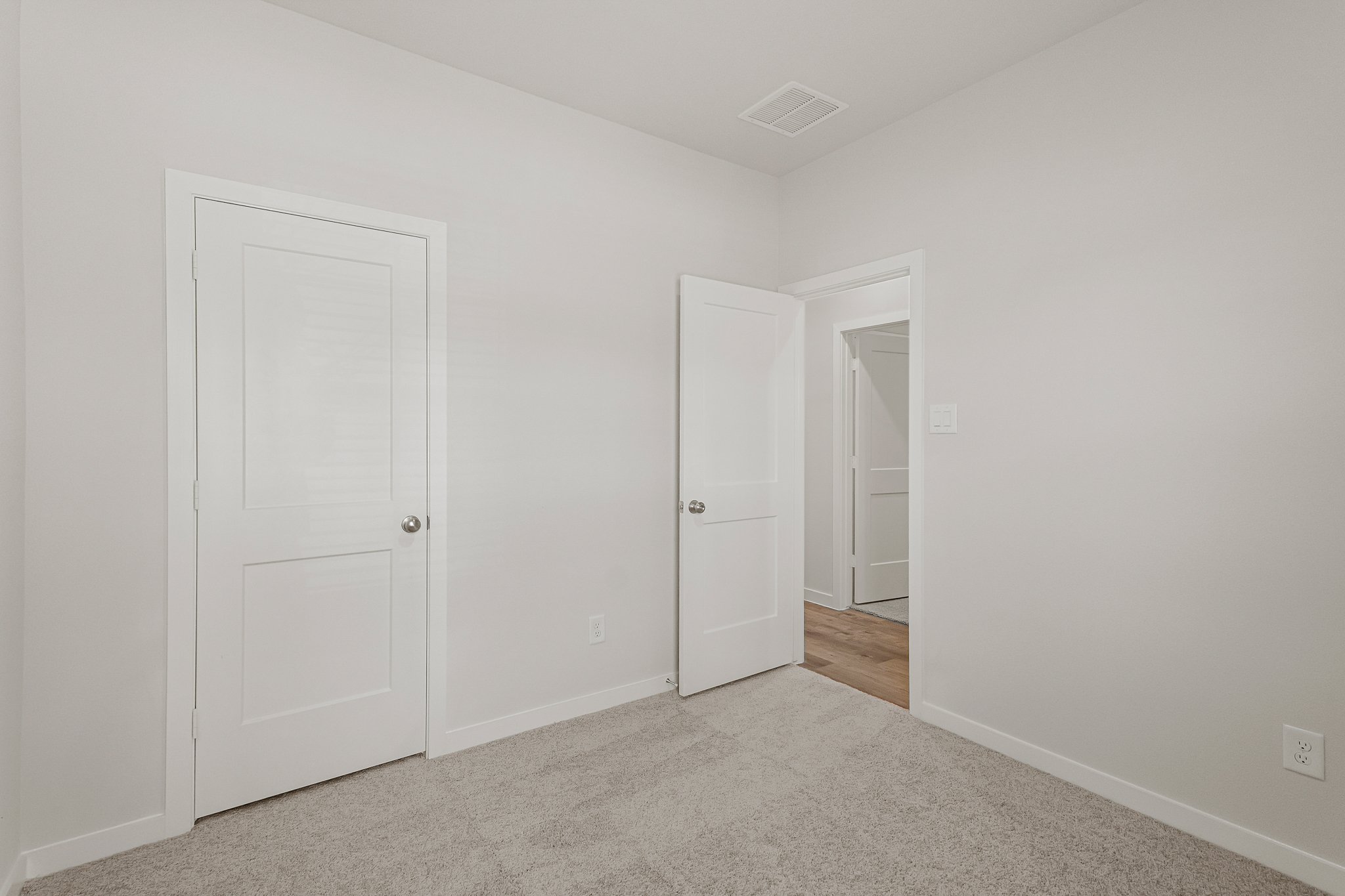 A room with white doors.