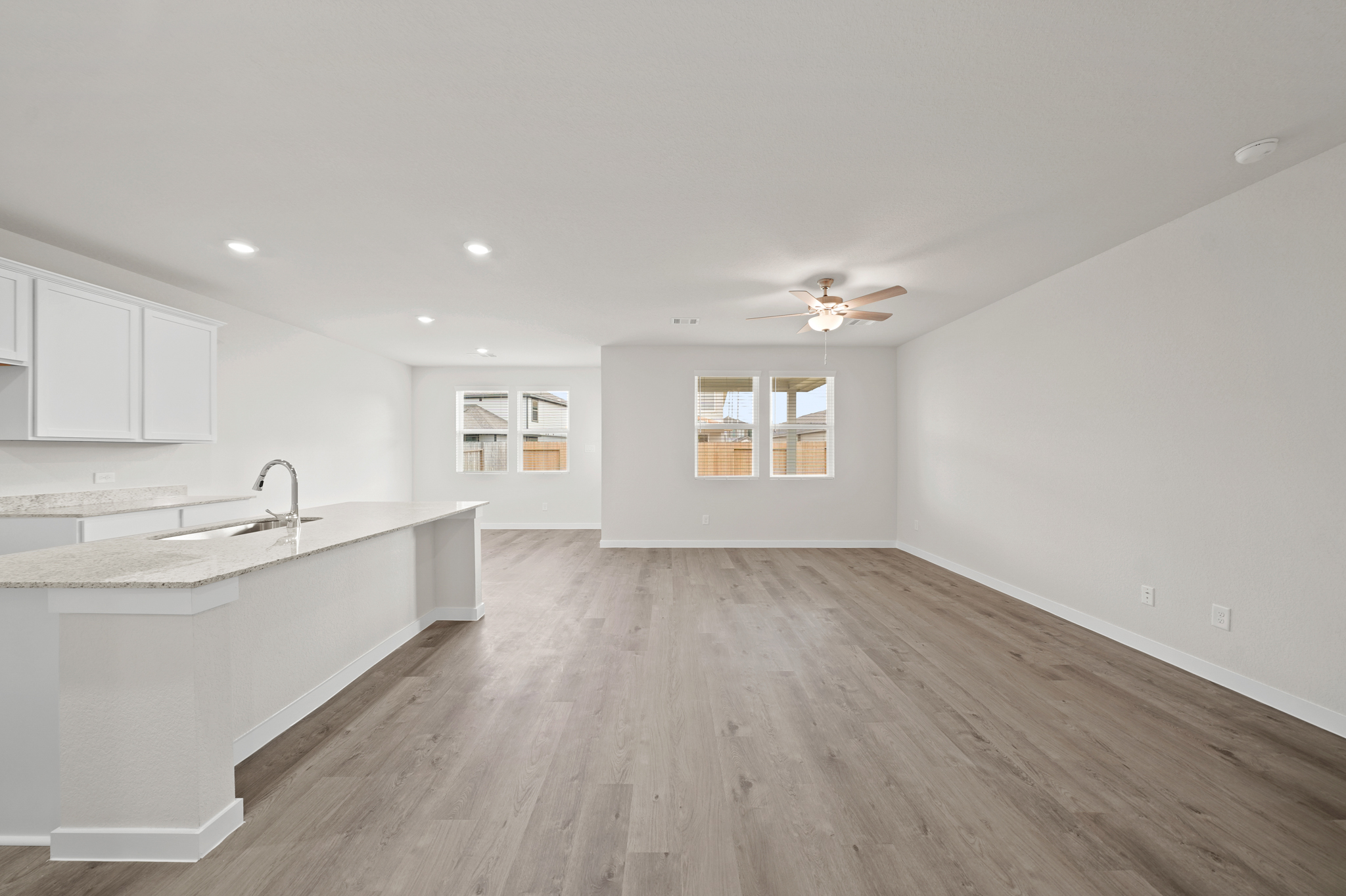 A kitchen with a wood floor.