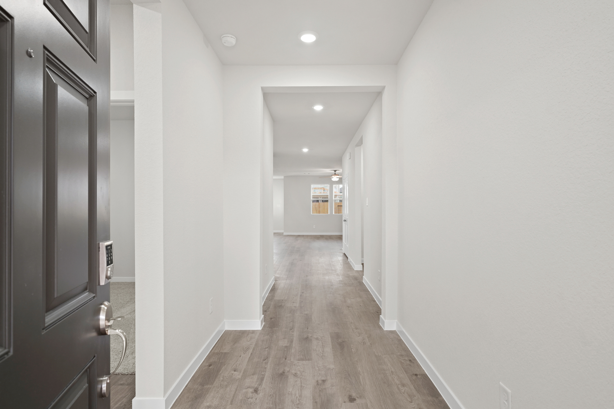 A hallway with white walls.