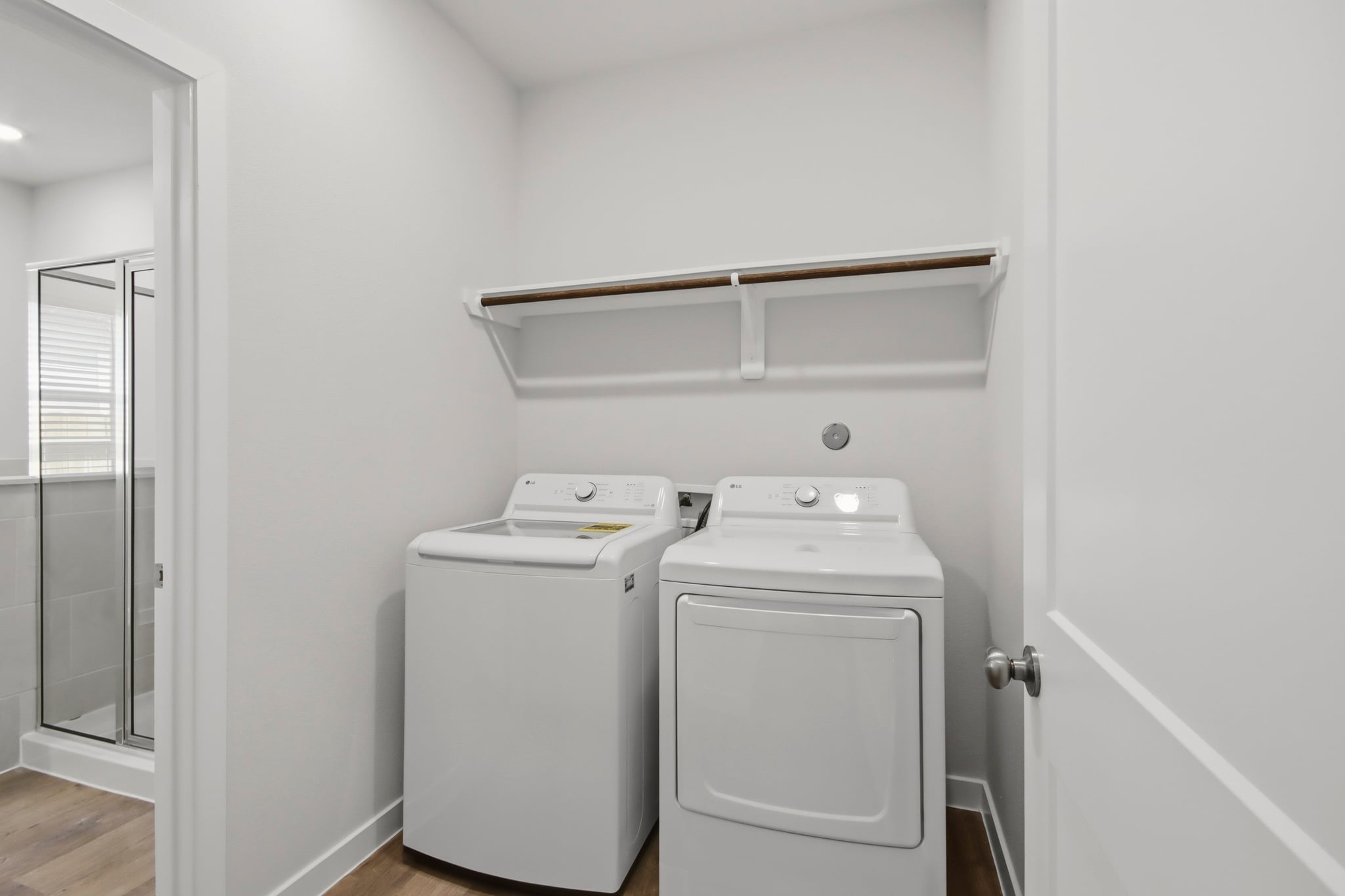 A washer and dryer in a room.