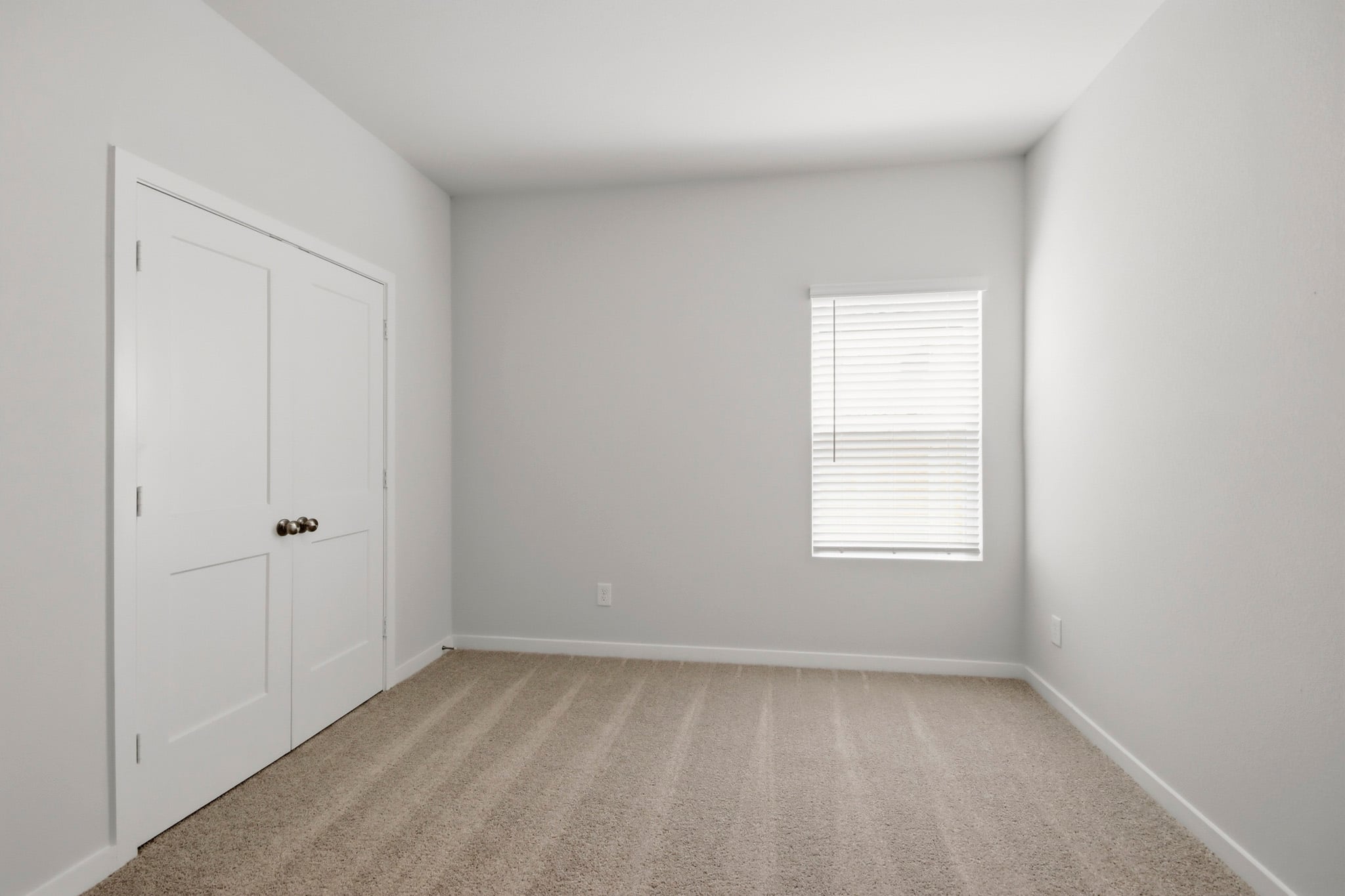 A room with white doors.