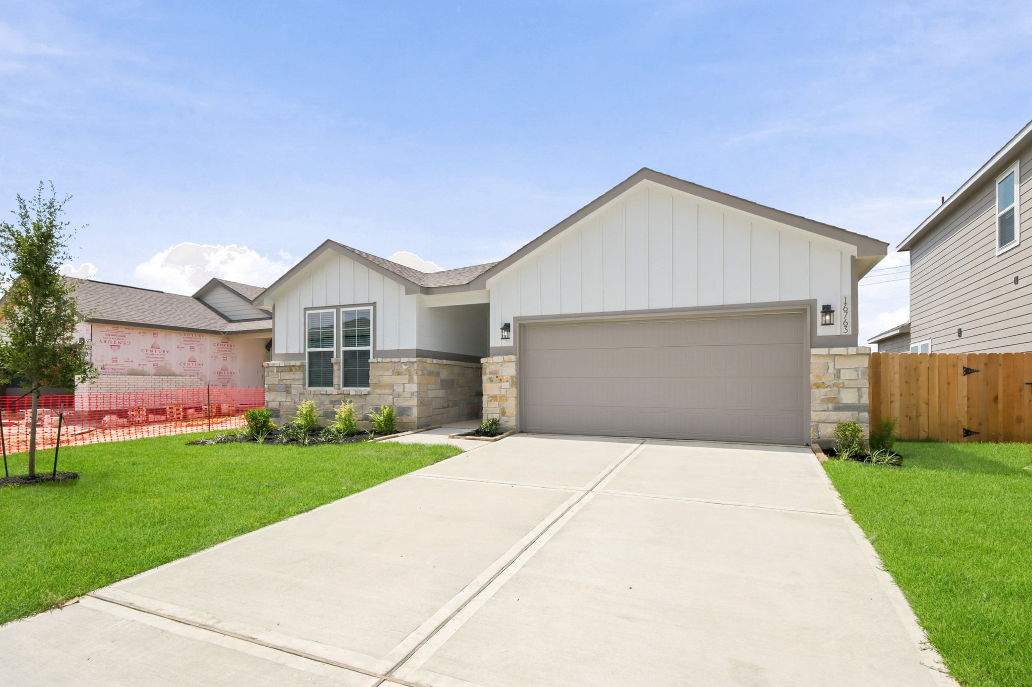 A driveway leading to a house.
