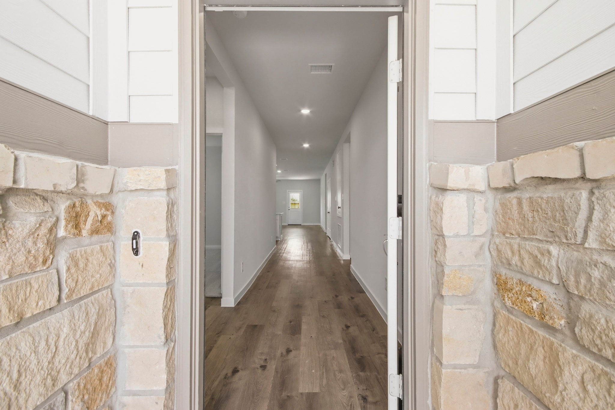 A hallway with stone walls.