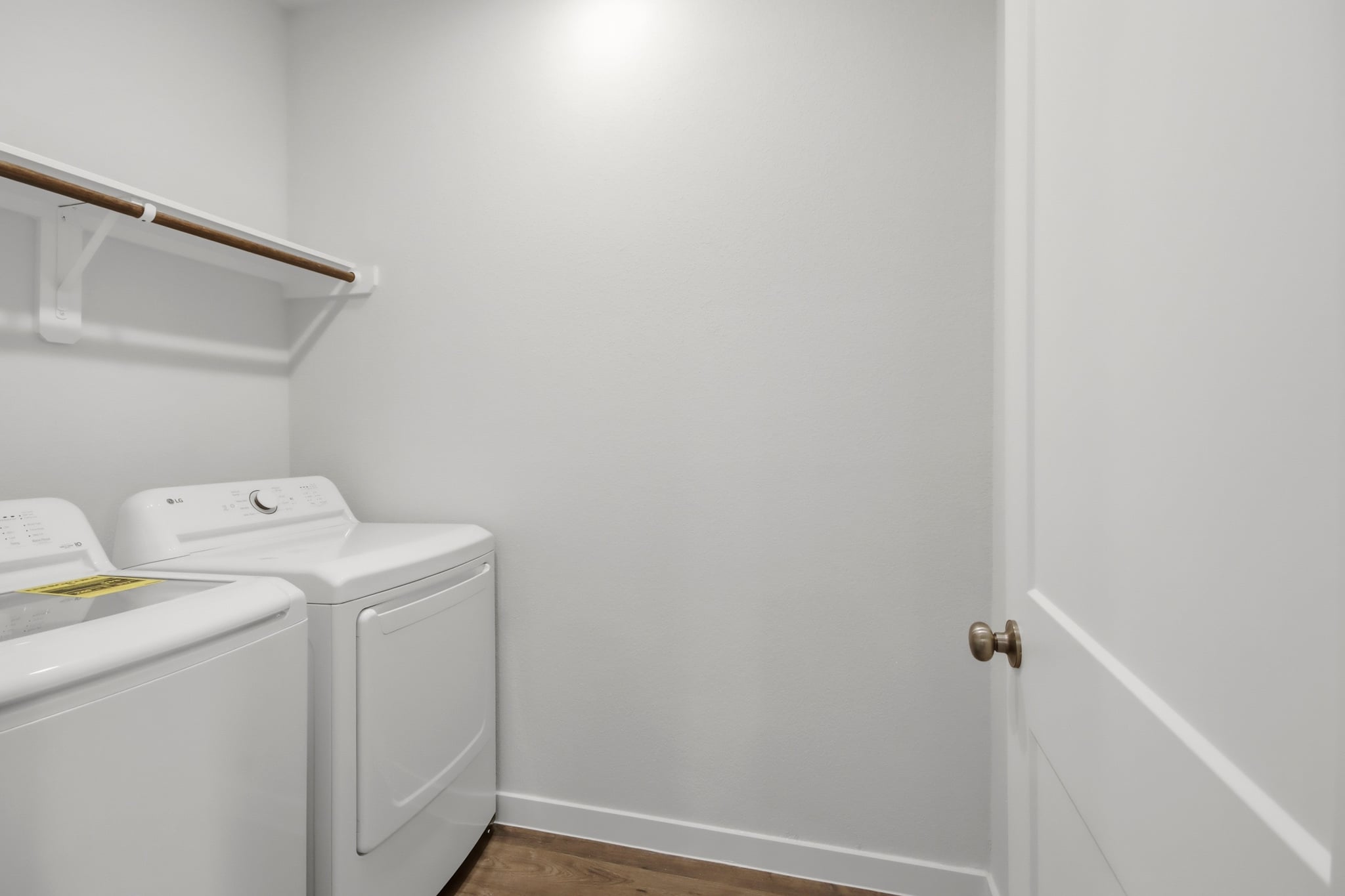 A white door next to a white door.