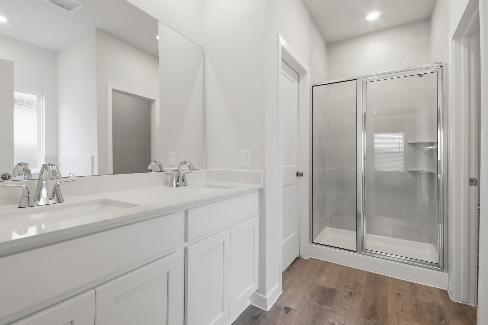 A bathroom with a glass shower.