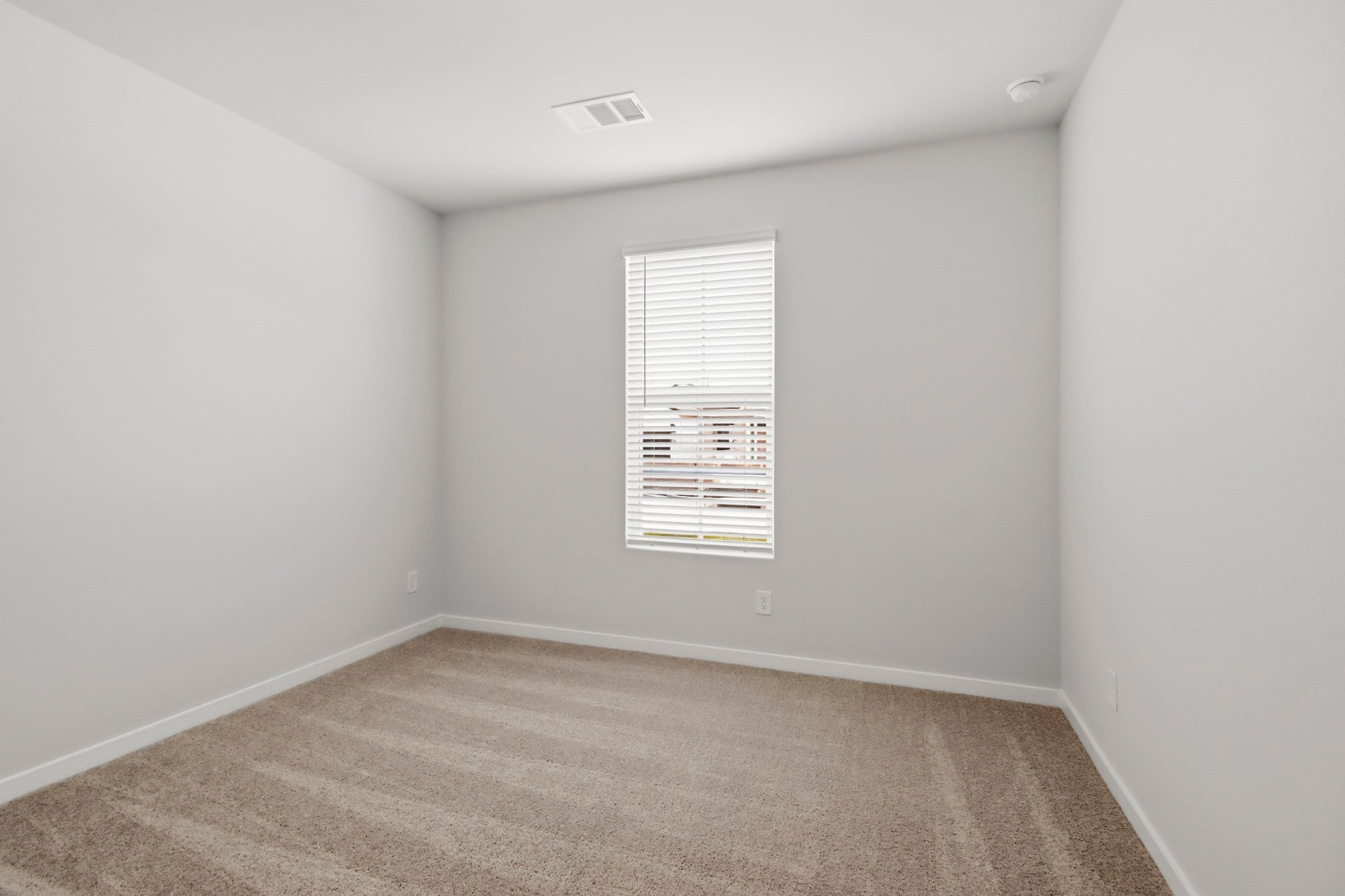 A room with a door and a window.