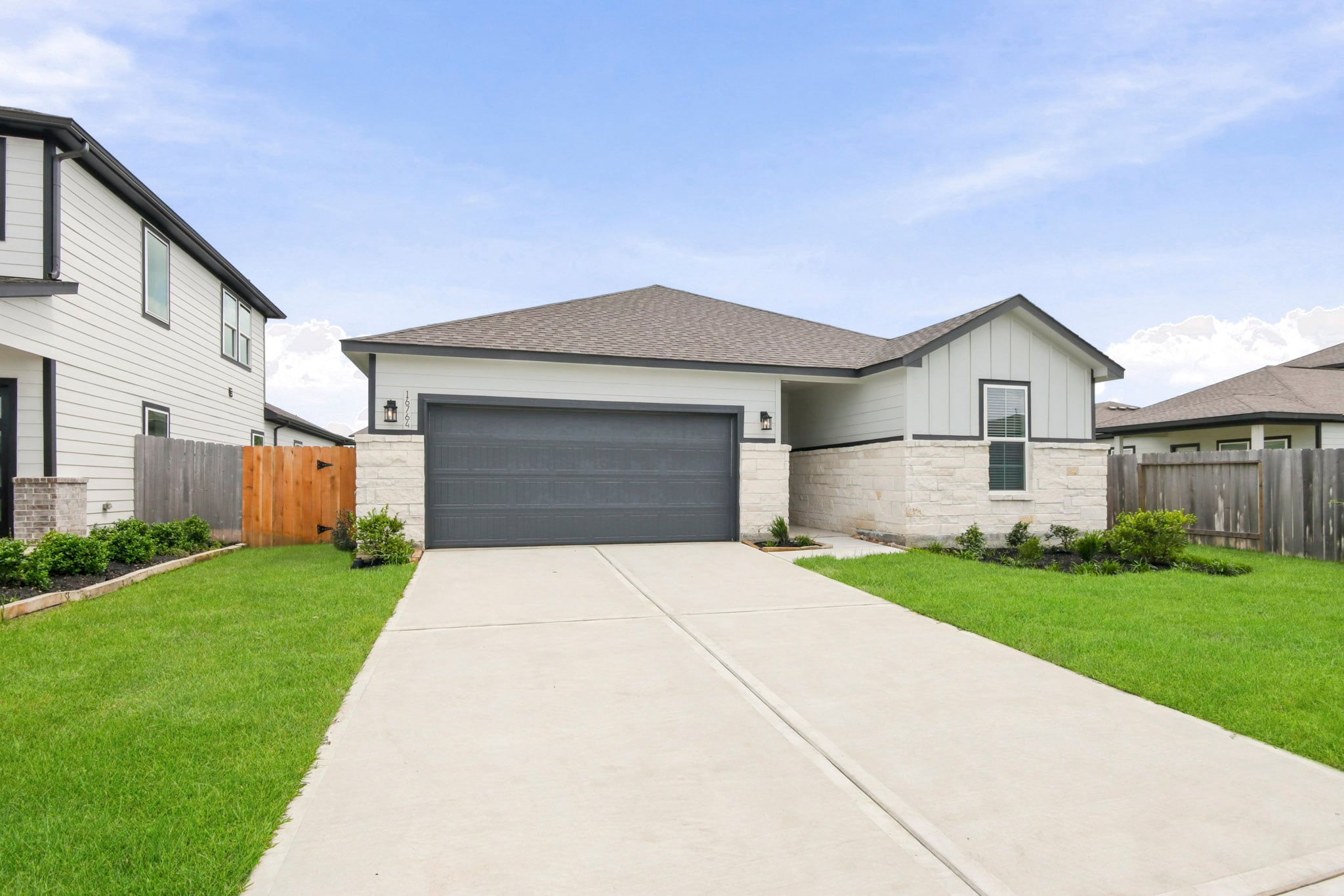 A driveway leading to a house.