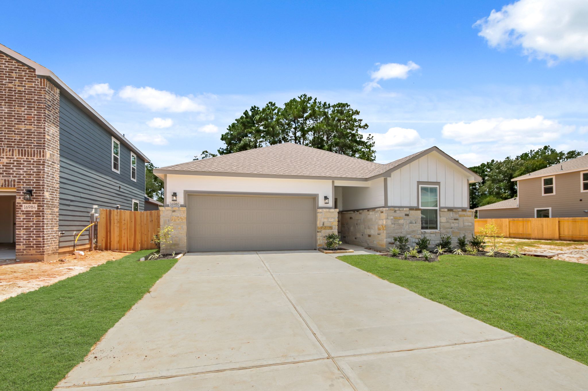 A driveway leading to a house.