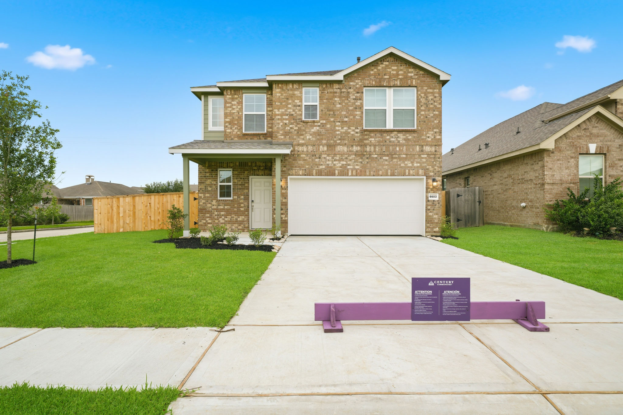 A driveway leading to a house.
