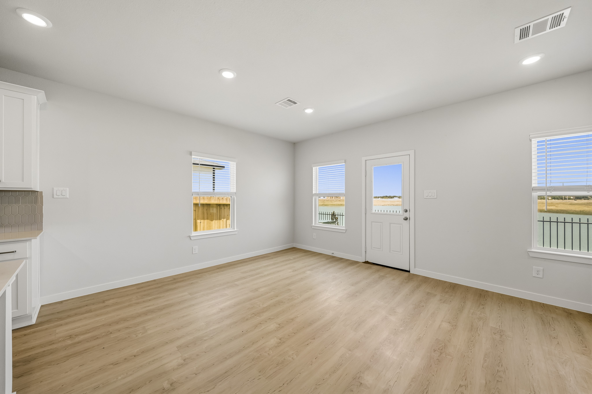 A room with white walls and windows.