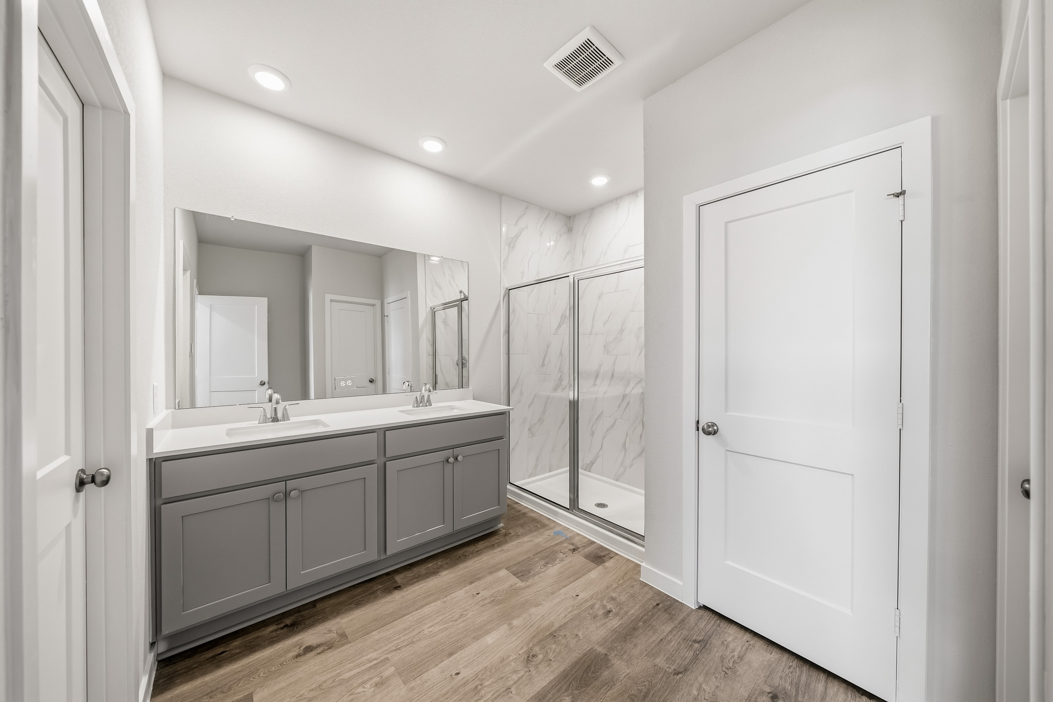 A bathroom with a glass shower.