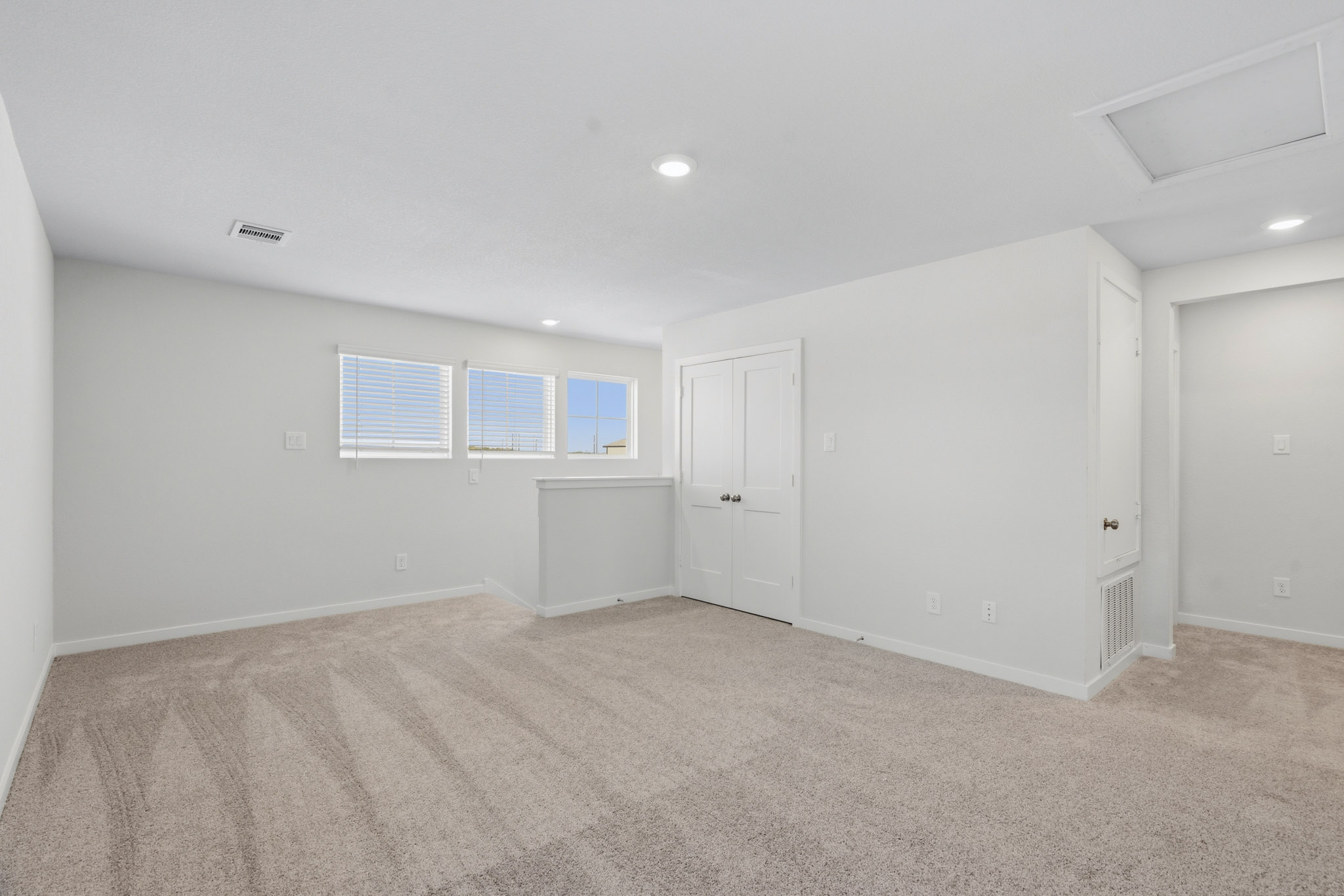 A room with white doors.
