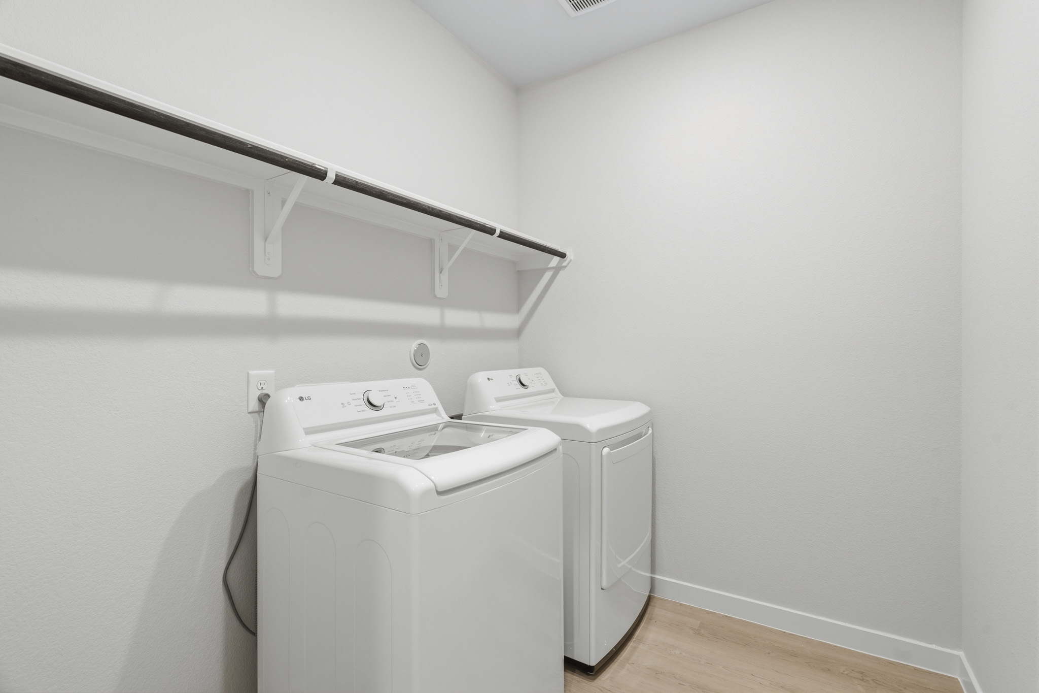 A white washing machine in a room.
