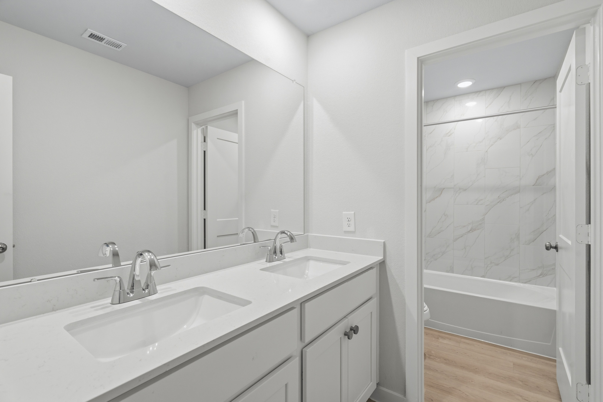 A bathroom with a glass shower.