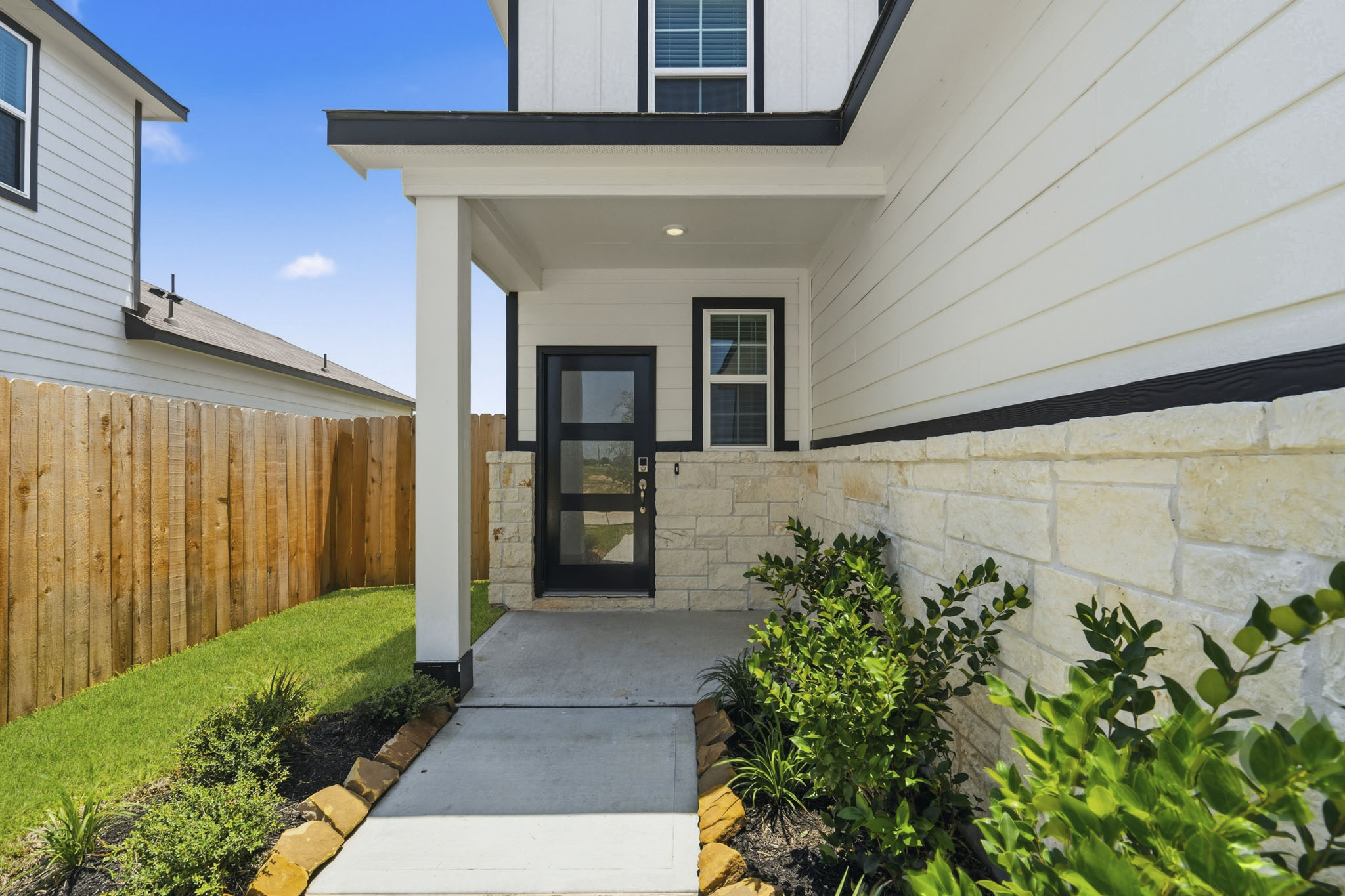 A house with a fence and a door.