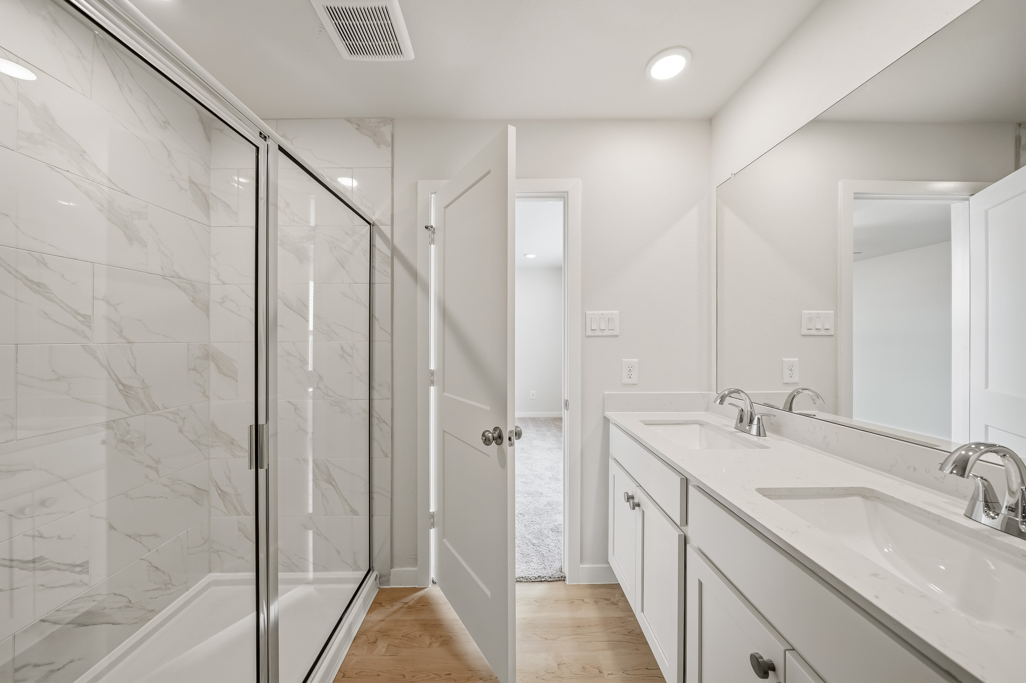 A bathroom with a glass shower.
