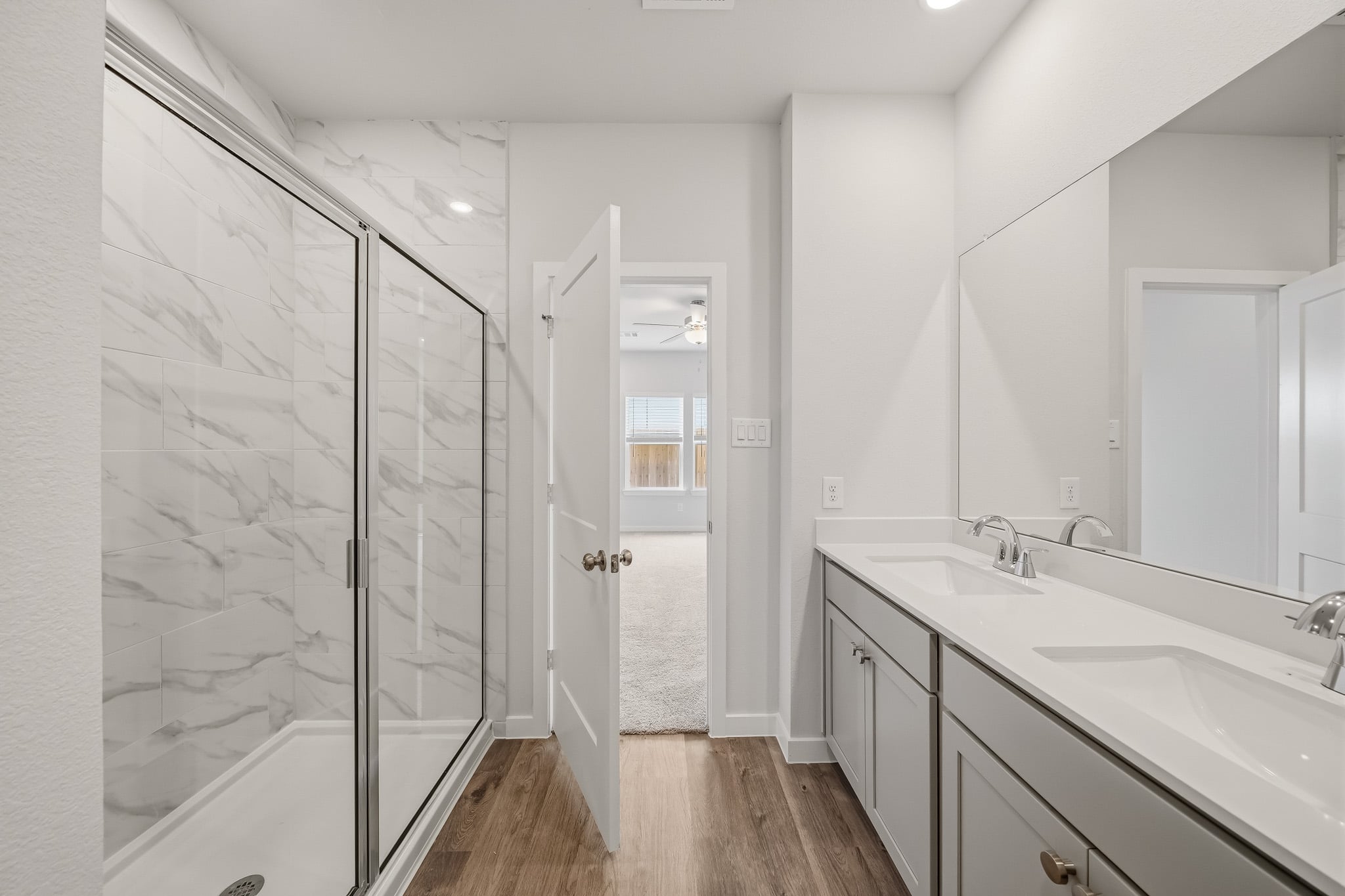 A bathroom with a glass shower.