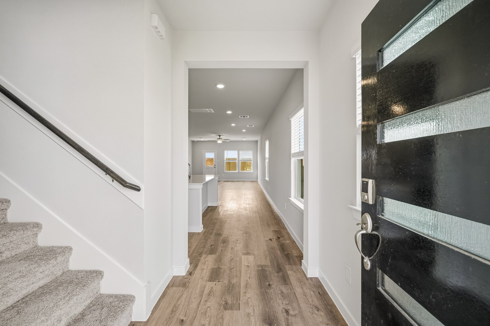 A hallway with white walls.
