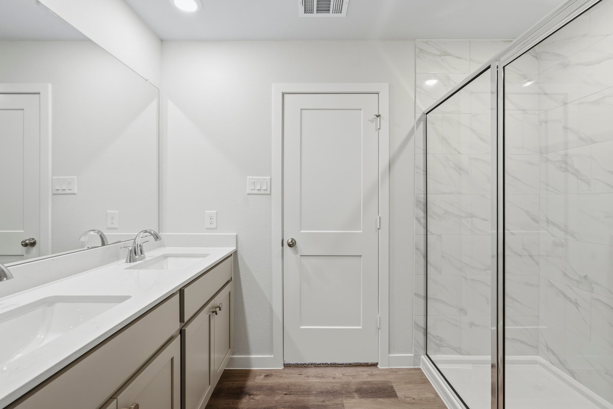 A bathroom with a glass shower.