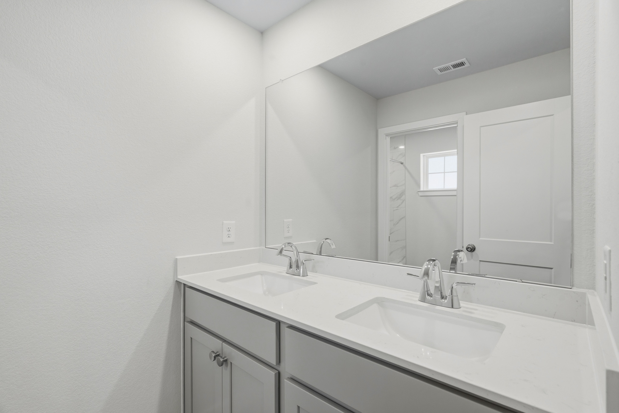 A bathroom with two sinks.