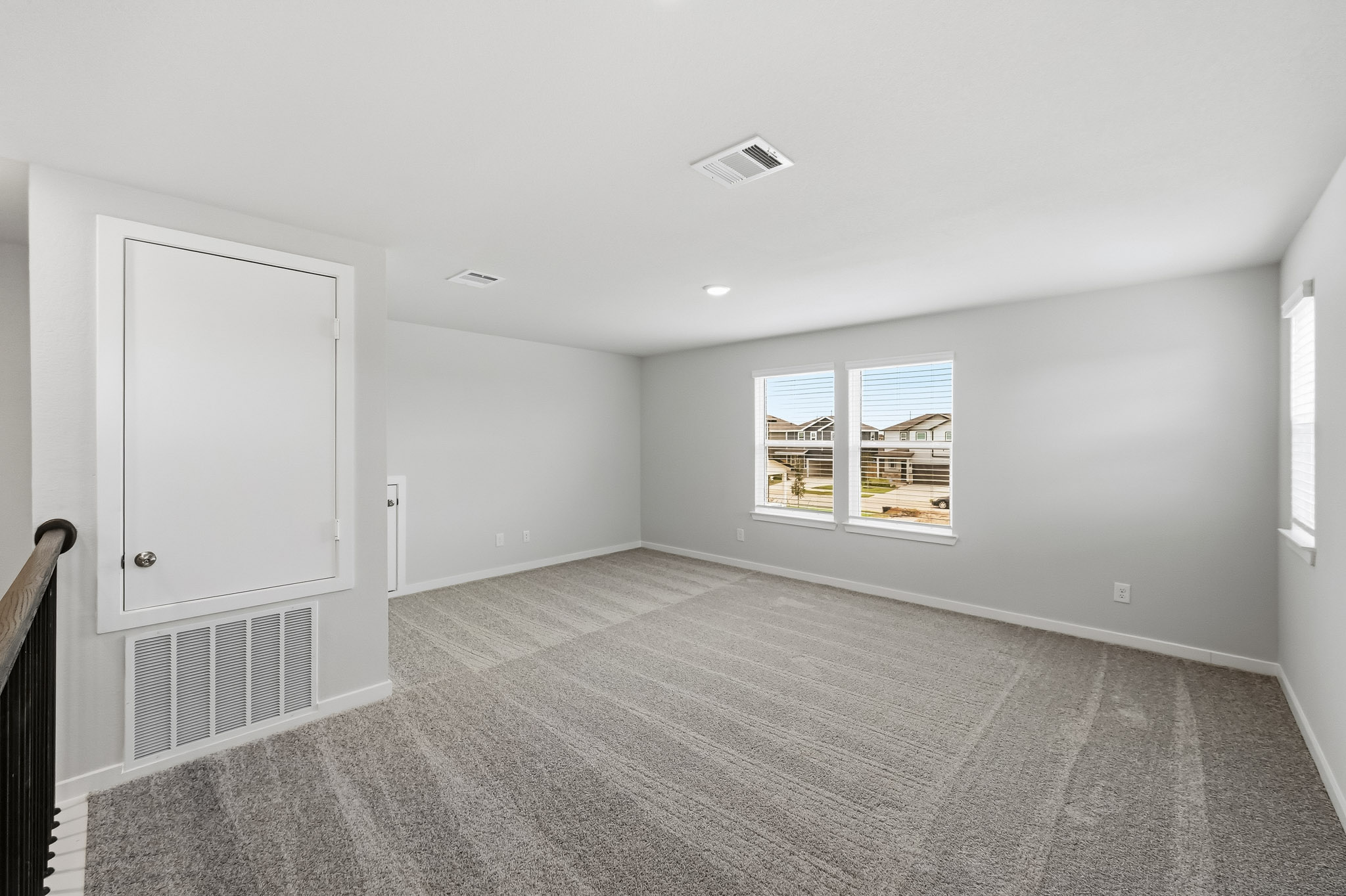 A room with a window and a door.