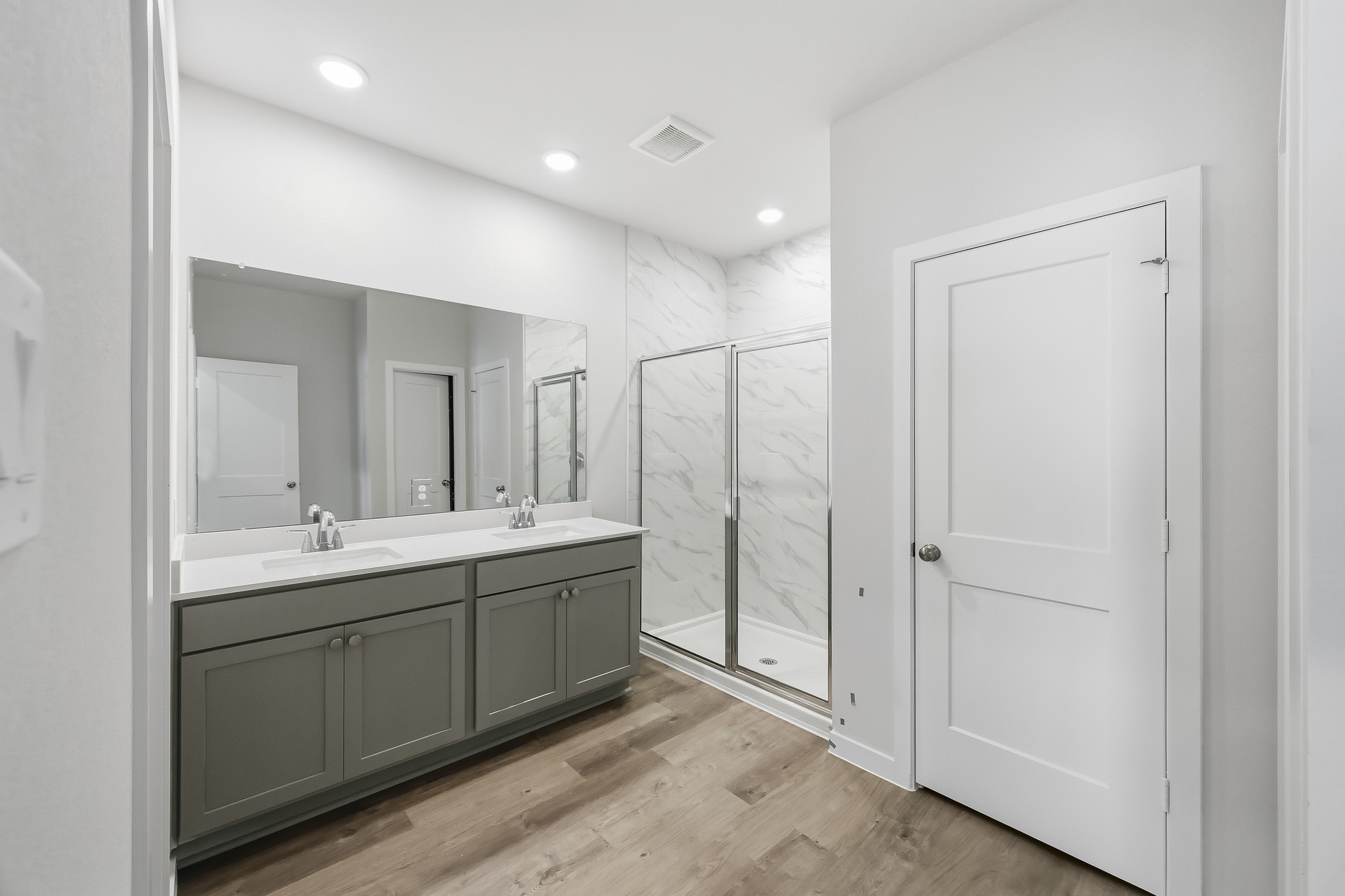 A bathroom with a glass shower.