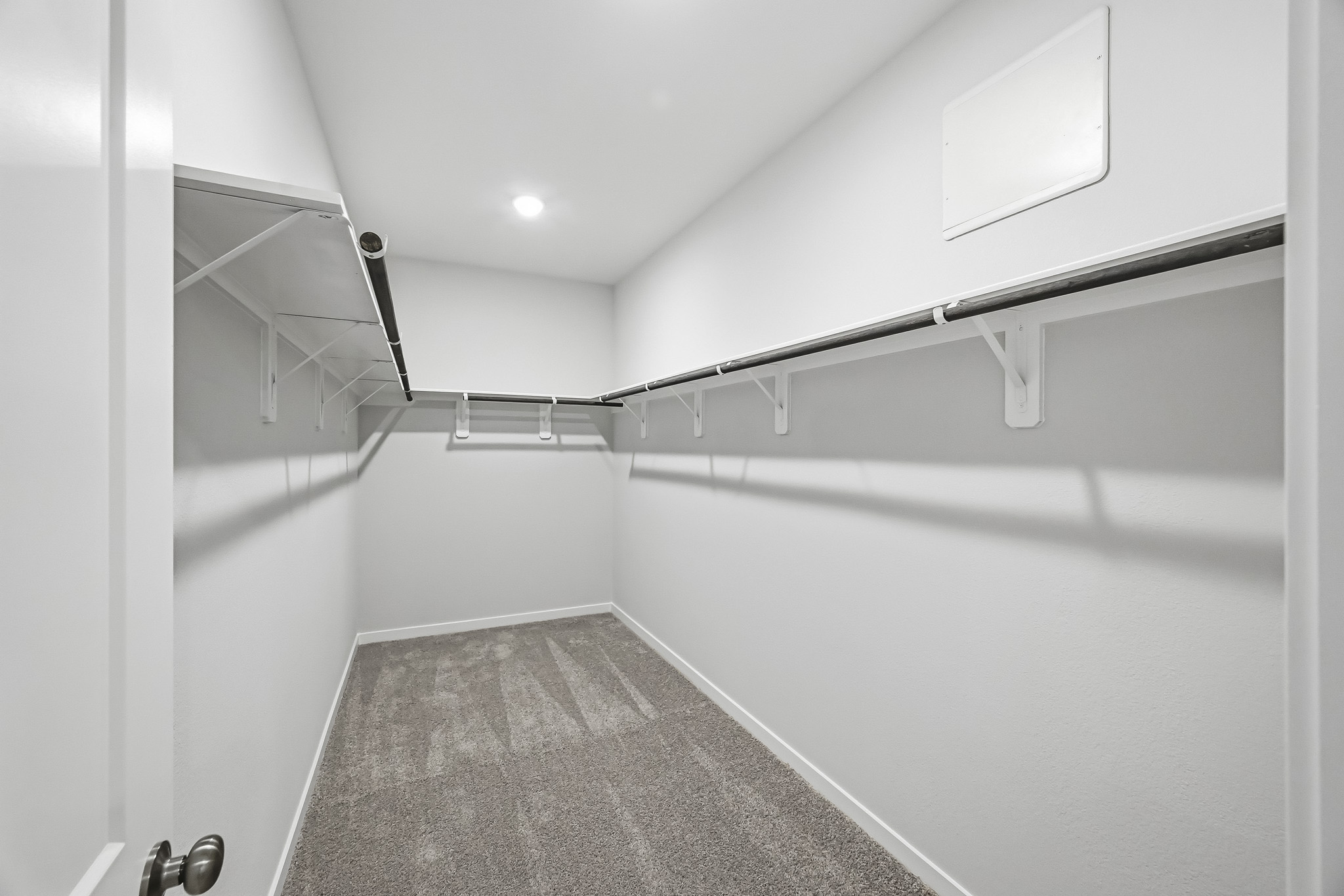 A hallway with white walls.