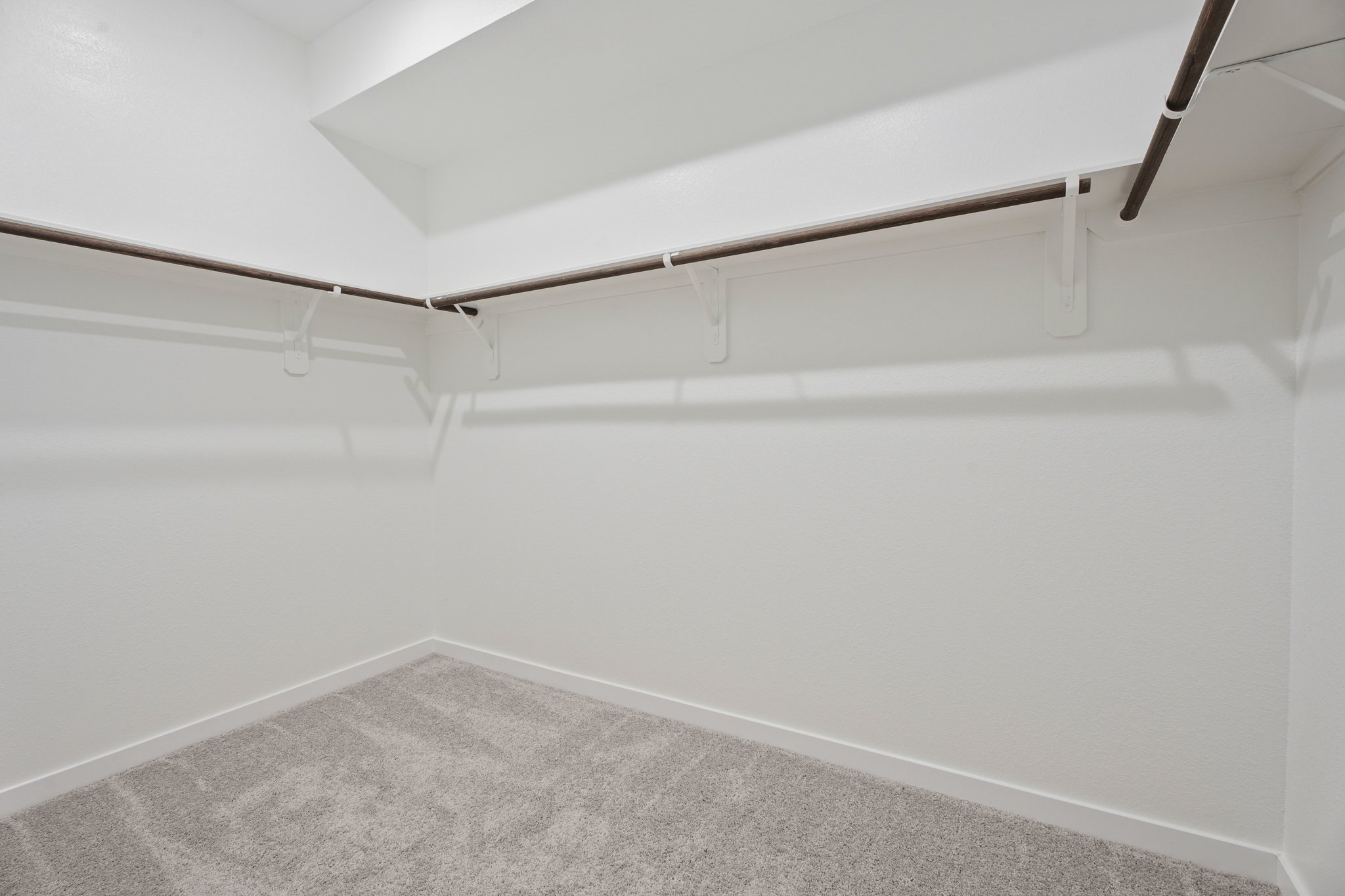 A white wall with a white floor.